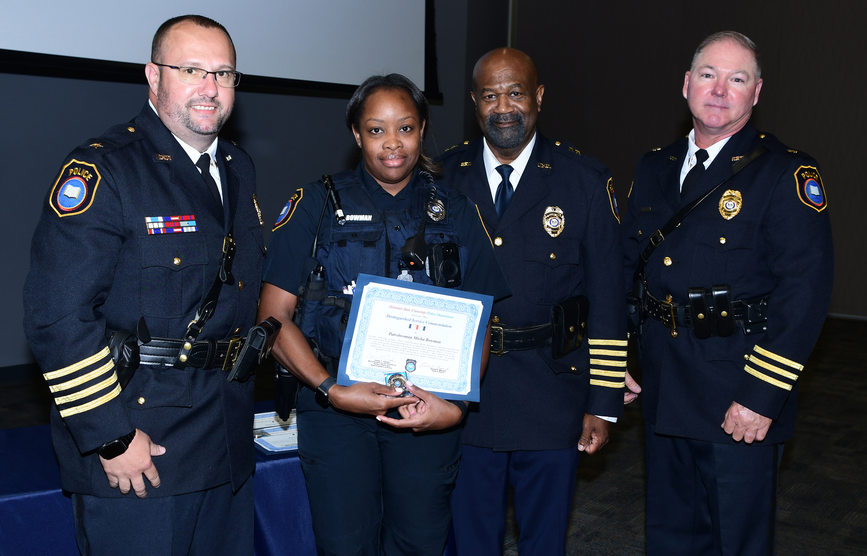 Patrolwoman Micha Bowman receives a Distinguished Service Commendation.