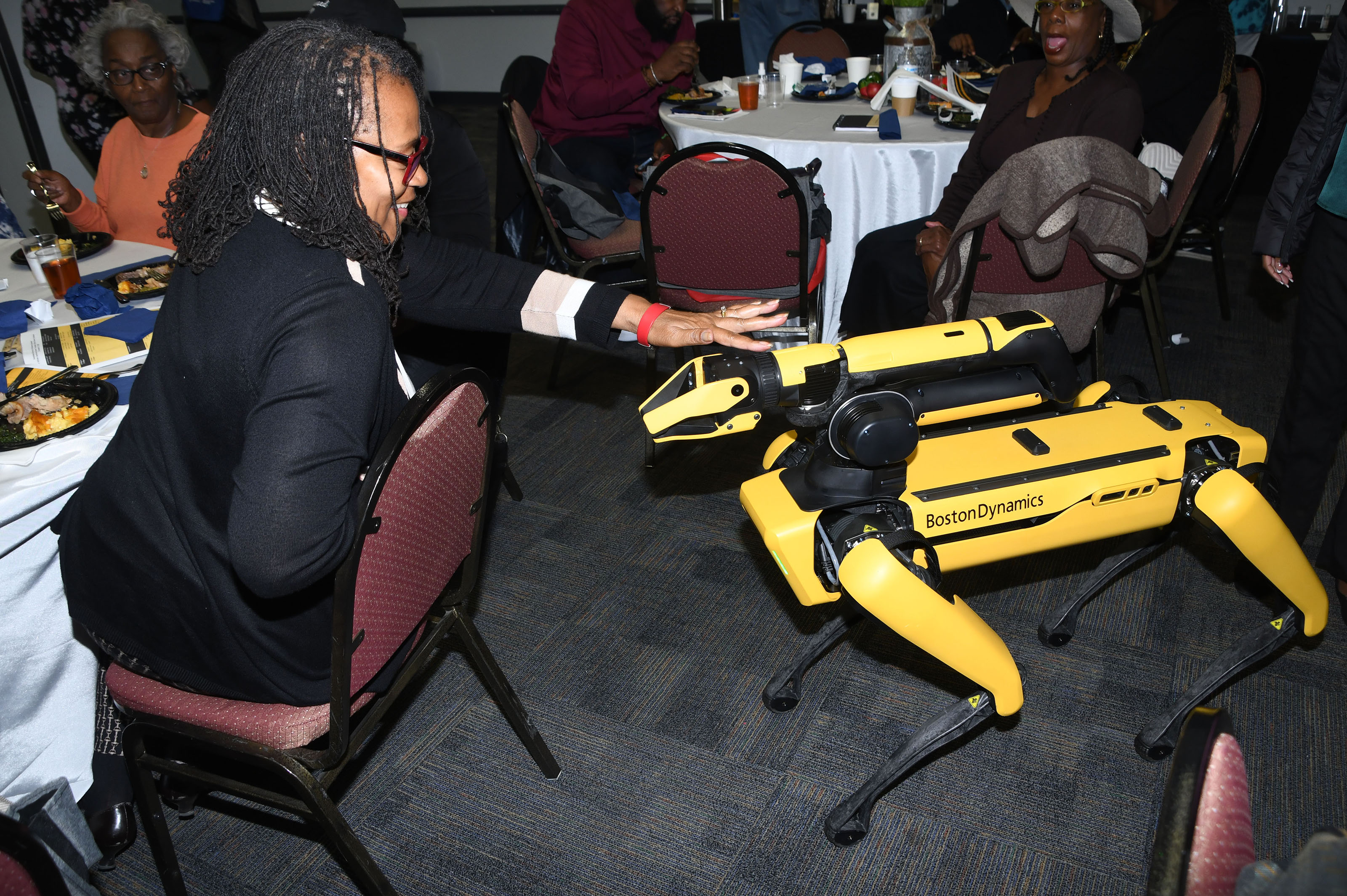 A conference attendee checks out an agriculture robot that can detect diseases in crops and remove them before spreads.