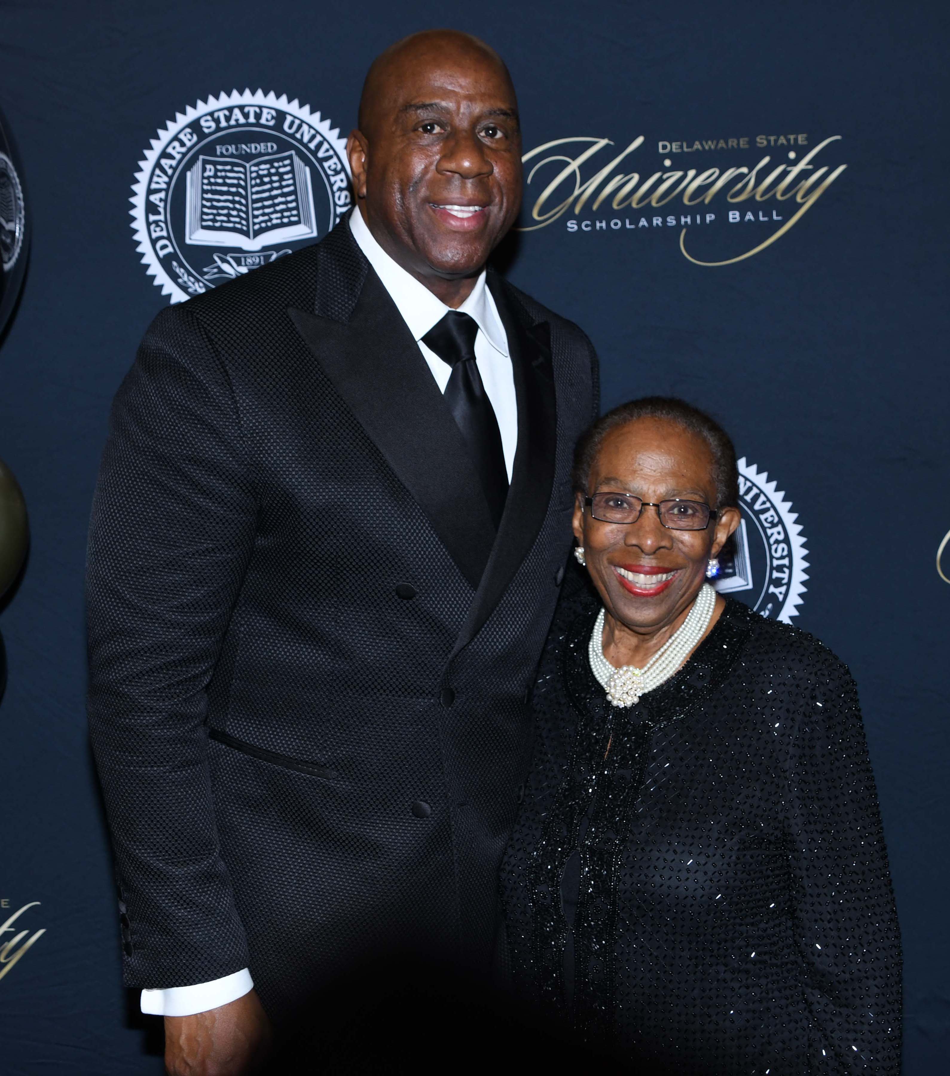 Magic Johnson took a lot of photos with a lot of people, including this one with DSU alumna Dr. Reba Hollingsworth, '48.