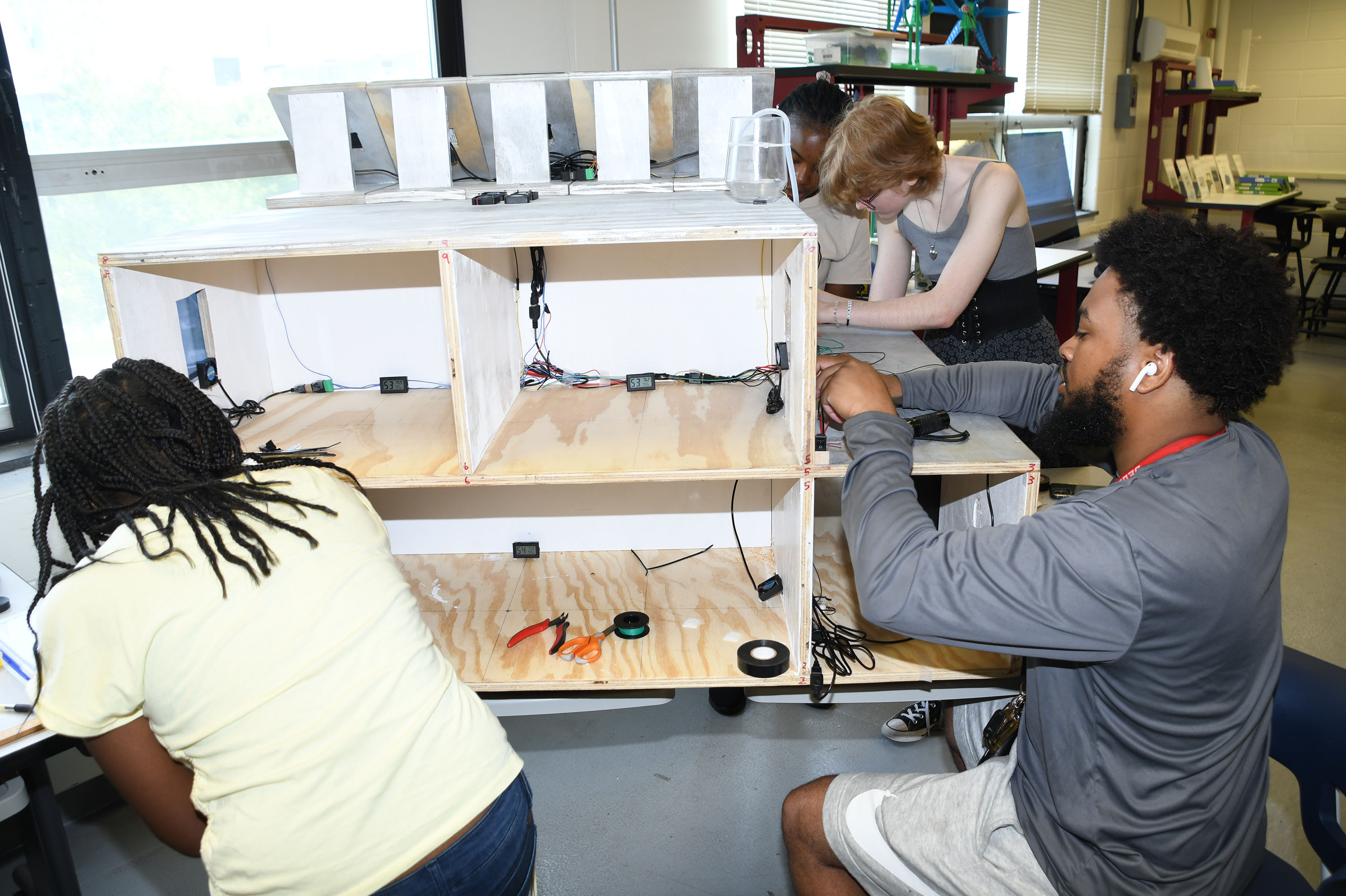 Workshop student build an energy efficient house, complete with solar panels.
