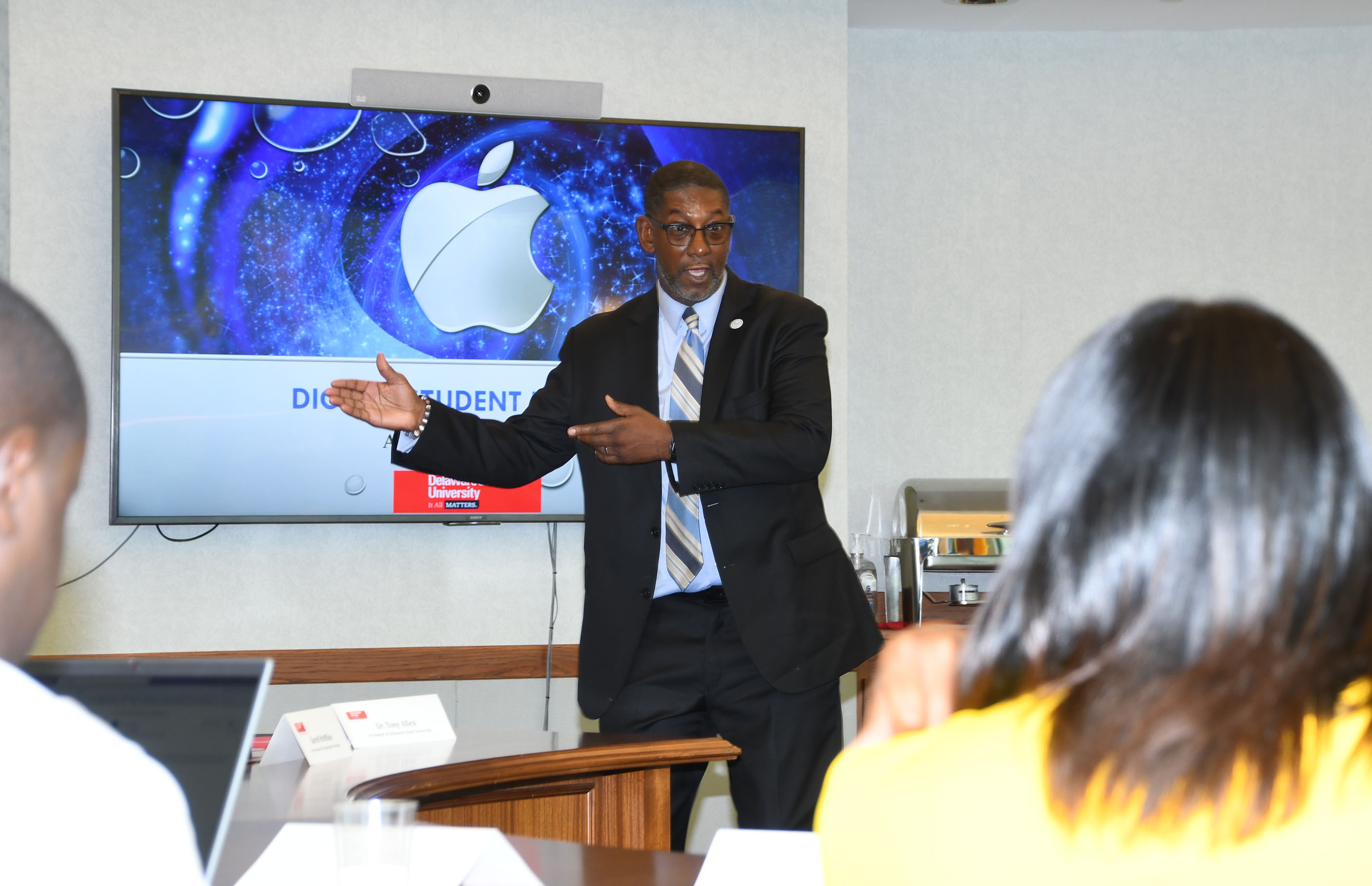 Darrell McMillon, University CIO, shares information about the Apple Initiative with visitors from Fort Valley St. University.