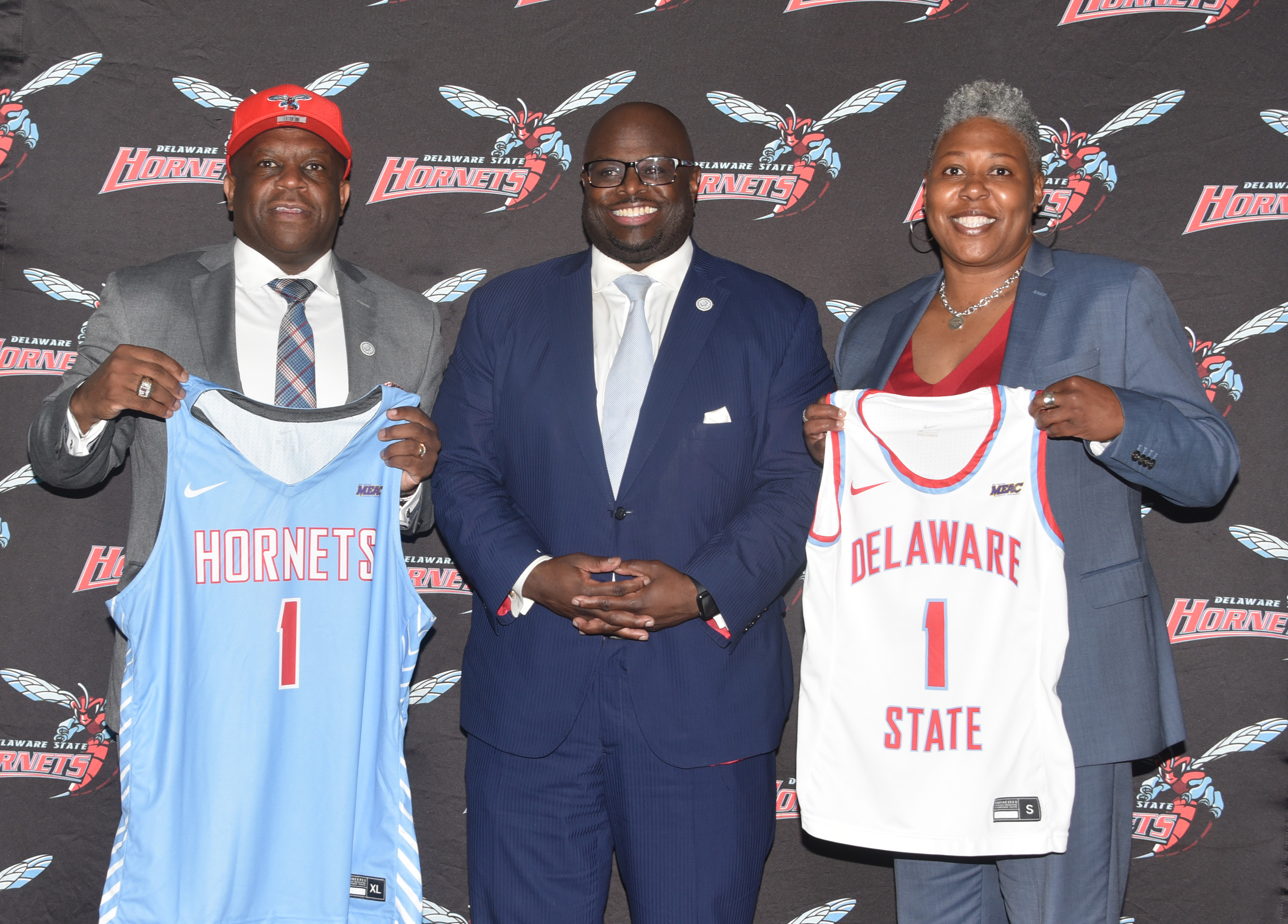 University President Tony Allen (c), stands with new coaches Stan Waterman and Yconda "EC" Hill.