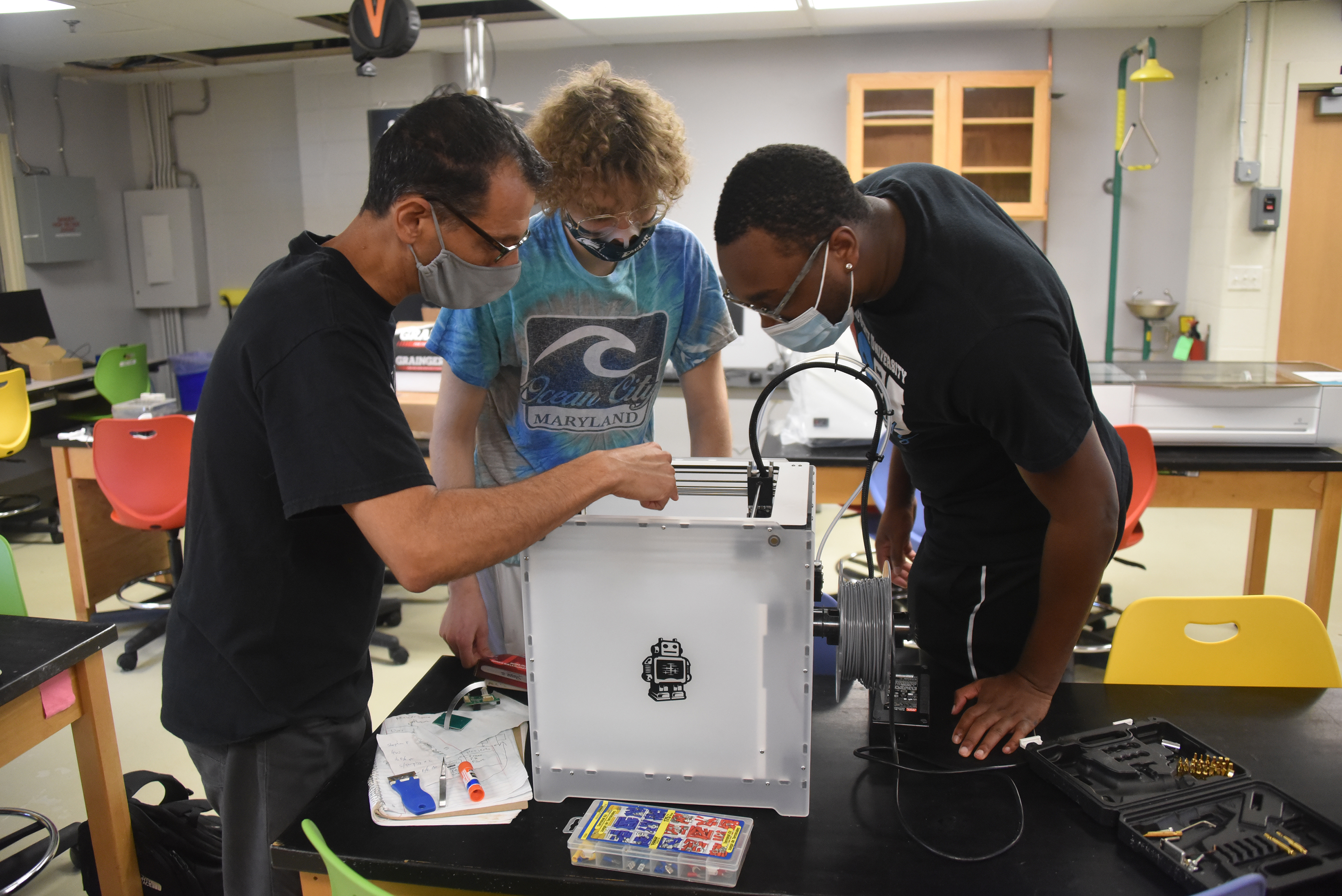 (L-r) Dr. Marwan Rasamny, Associate Professor of Computer Sci, Zakaria Juracka and Jameel Brice work in the Maker Space.