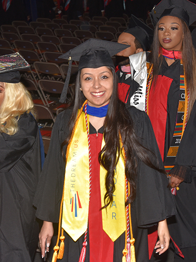 Dulce Guerrero marches in with other graduates at the start of the Commencement Ceremony.