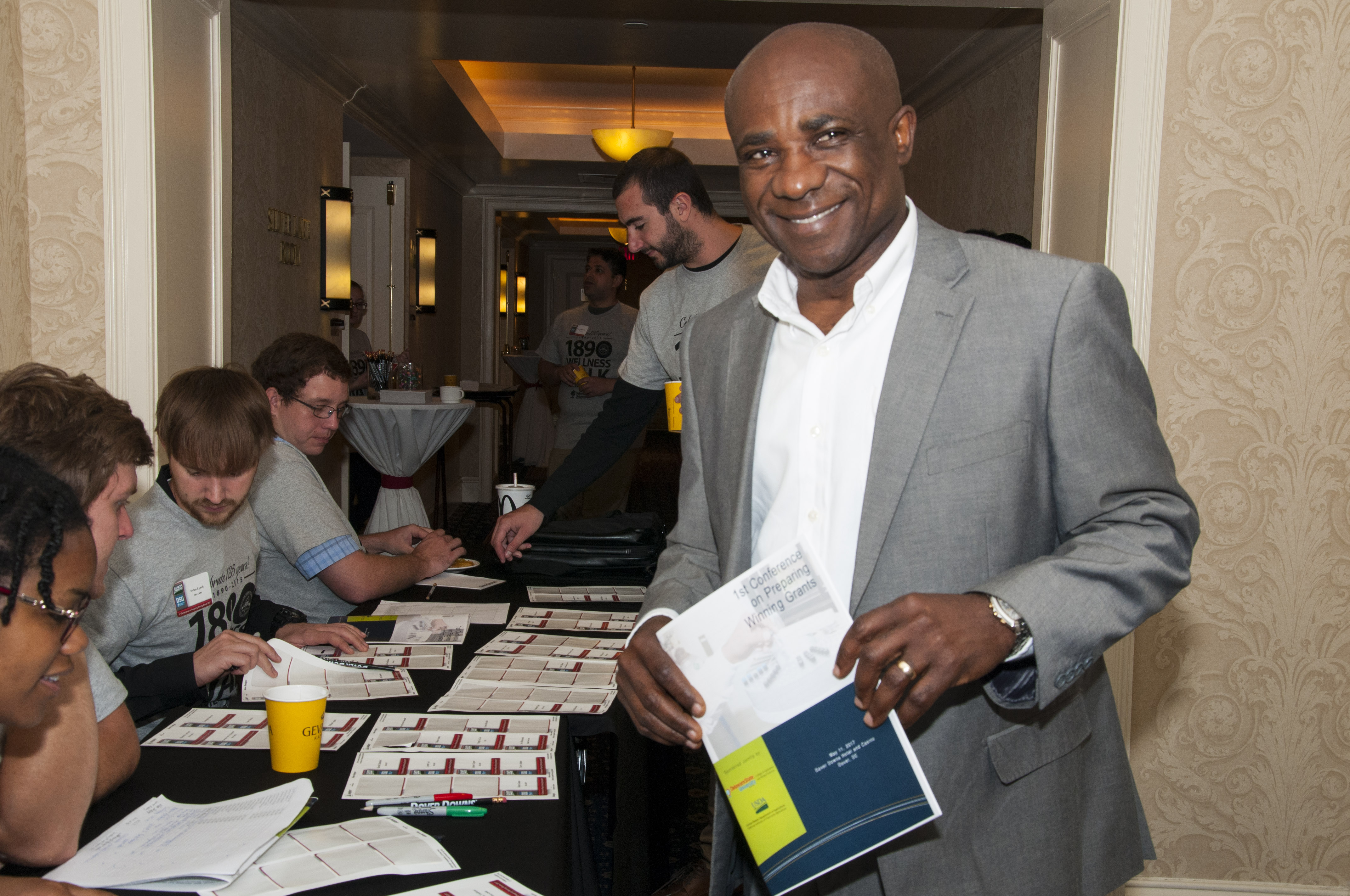 Attendees registering for conference.