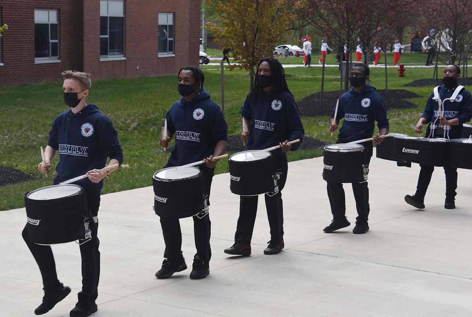 The drummers of the University's Approaching Storm Marching Band get their rhythm on during a April 17 parade around the campus.