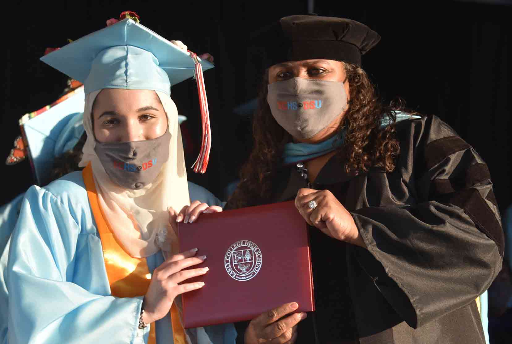 Zayna Juracka (l), Early College High School Class of 2021 Valedictorian, poses with her diploma and ECHS Director Dr. Evelyn Edney