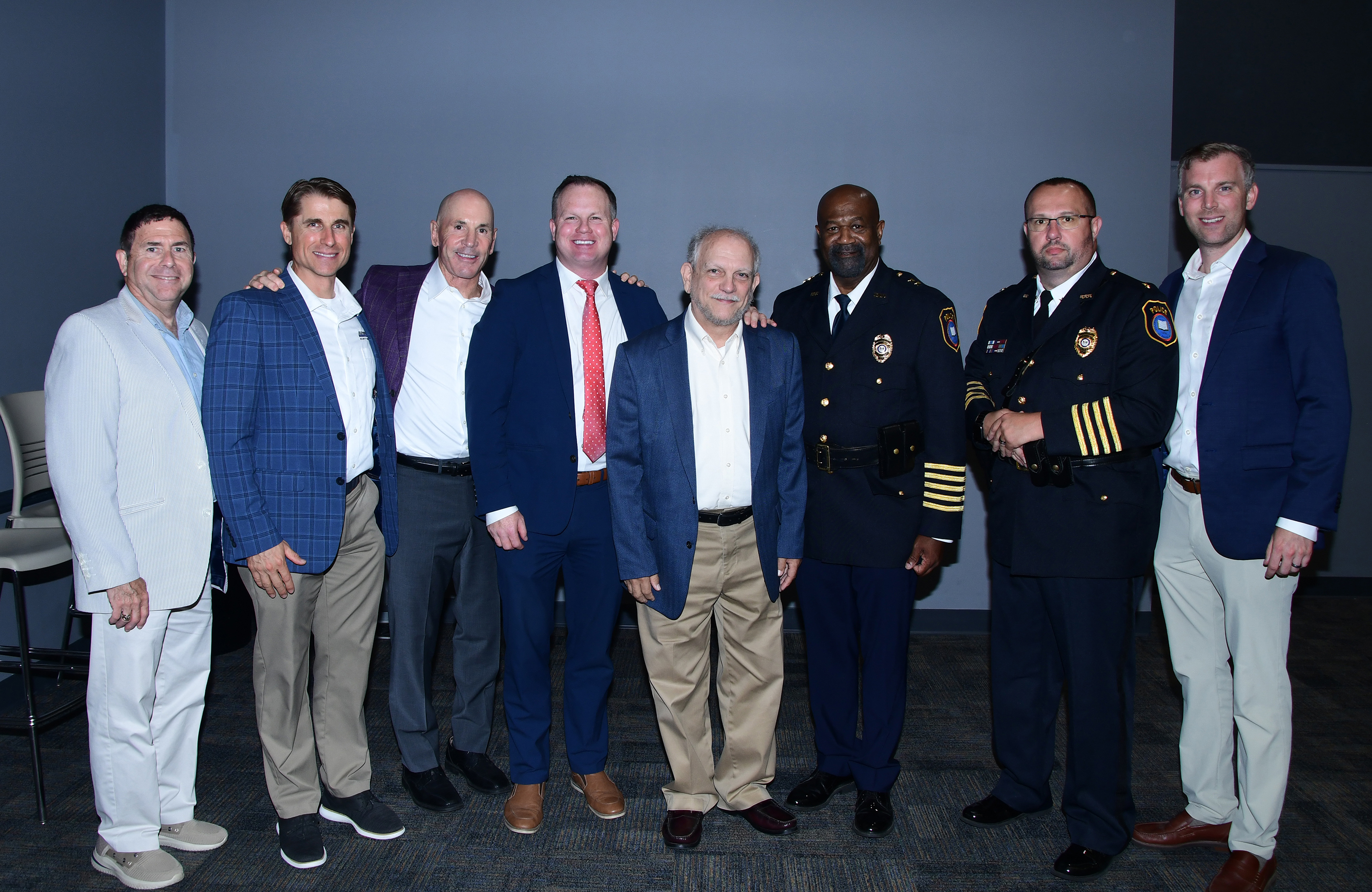 Superintendent Overton and Chief Baynard pose with representative of Advantech a security system partner of DSU.