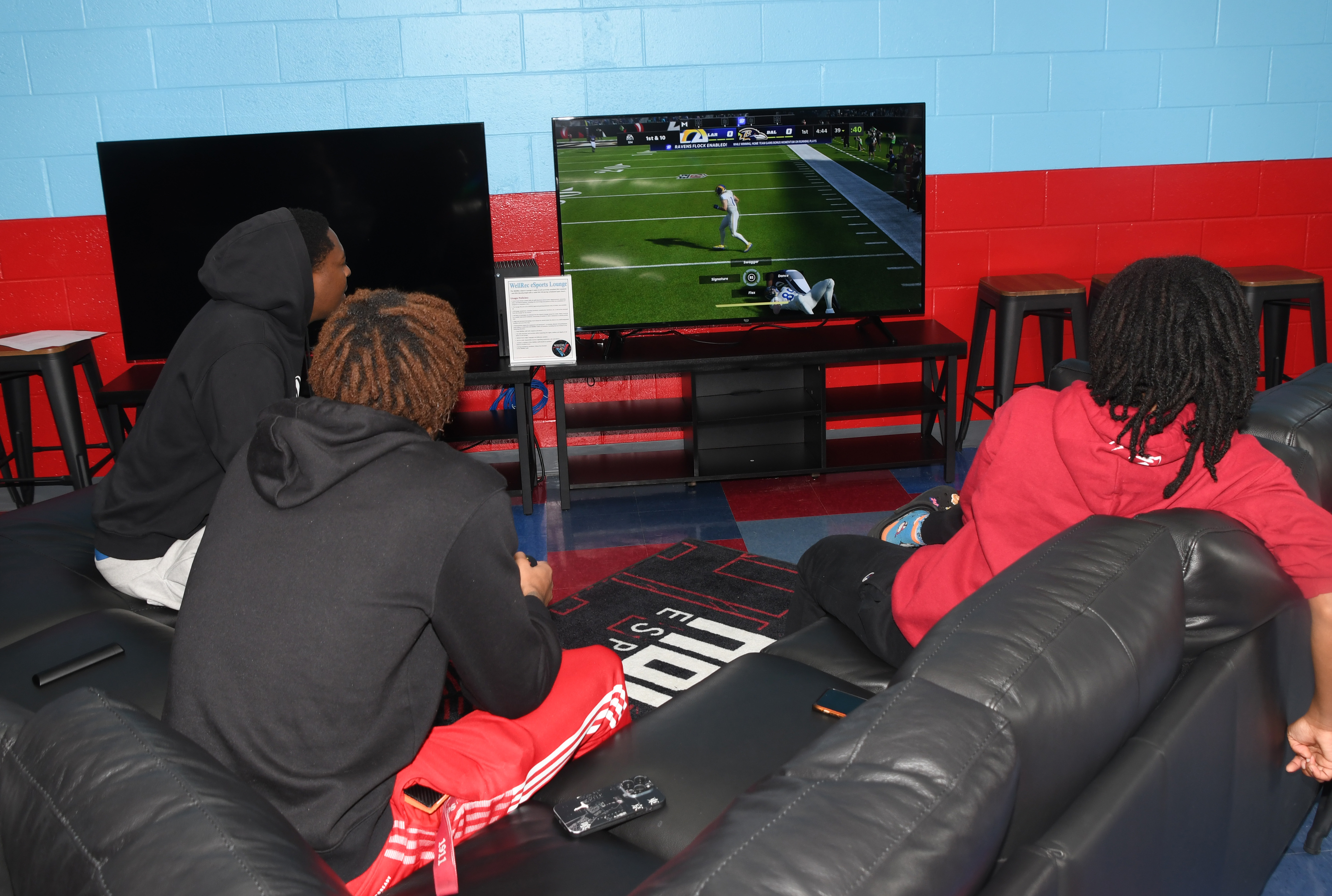 In addition to three walls of gaming computers, the eSports Lounges includes dual big screens and gaming couches.