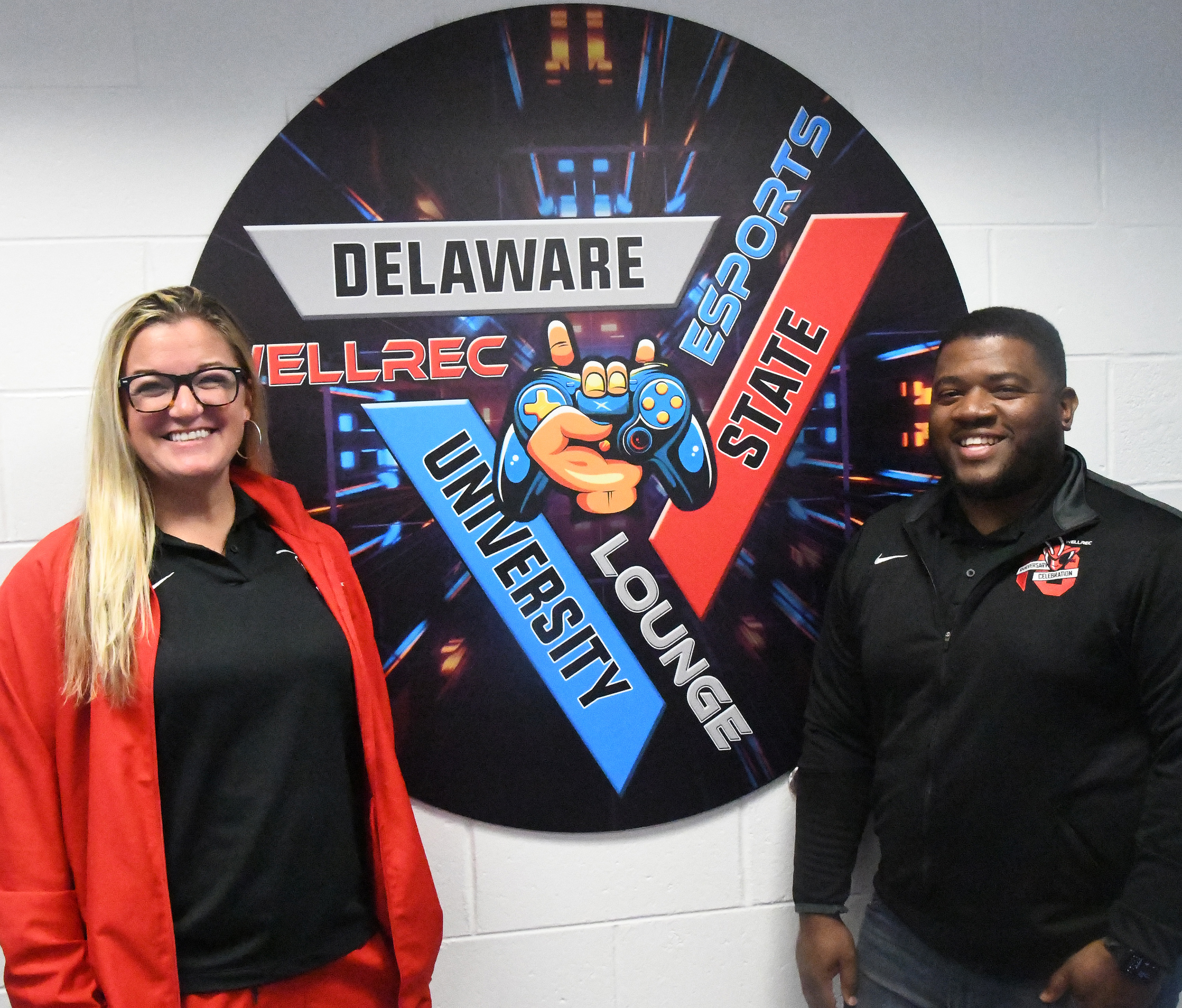 Jordin Williams and Wesley Davis stand with the eSports Lounge logo.