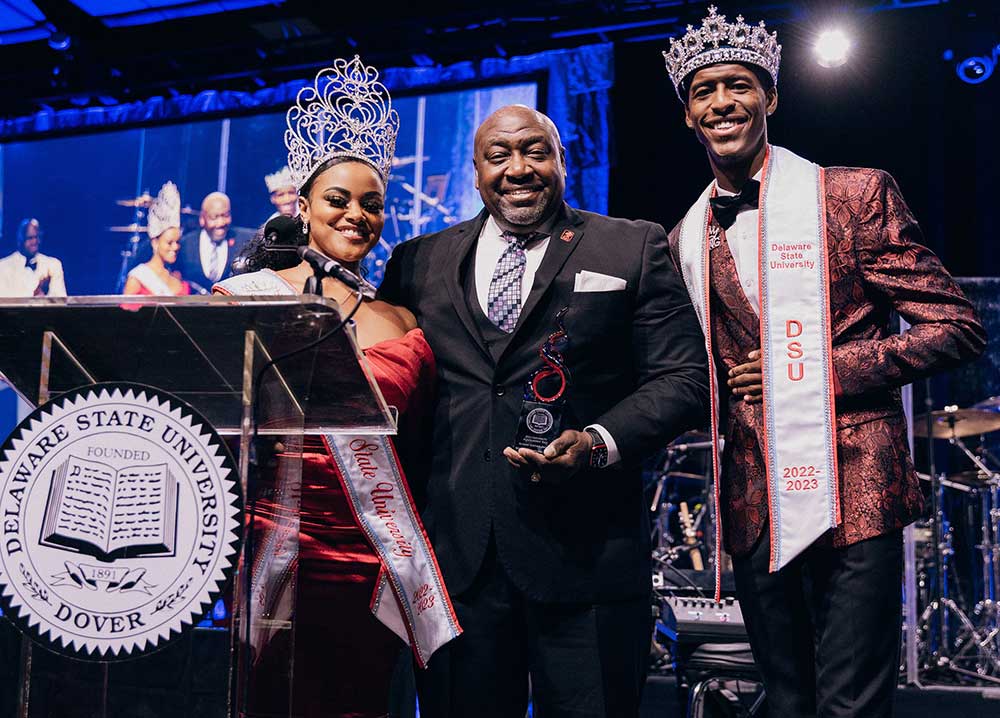 William "CJ" Charlton receives the Alumni Award from Mr. and Miss DSU at the Scholarship Ball