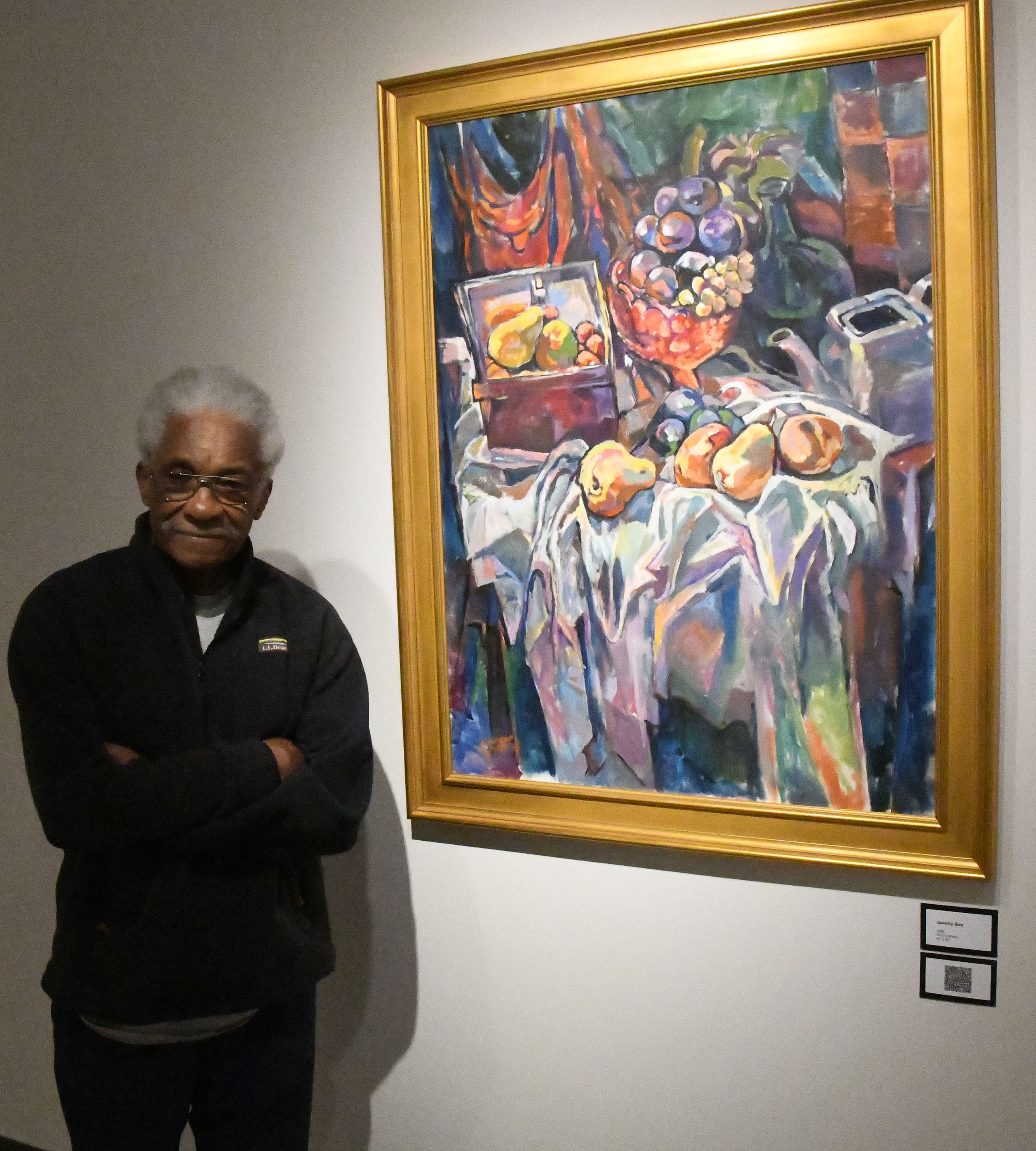 Edward Loper II stands next his work entitled "Jewelry Box."