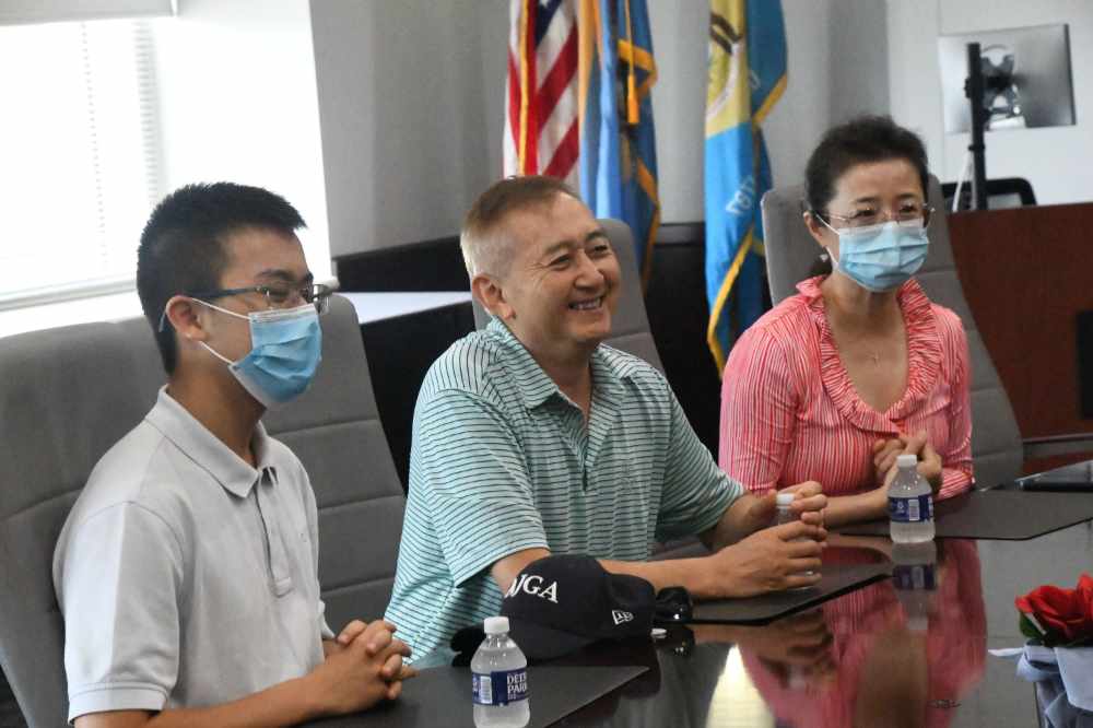 Zhang Wei ( center) wants to see more African Americans and Asian Americans among America's profession of attorneys