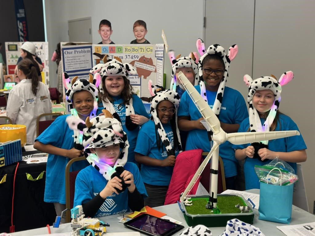 Members of the team from the Boys & Girls Club in Hockessin, Del., pose with their robotics project.