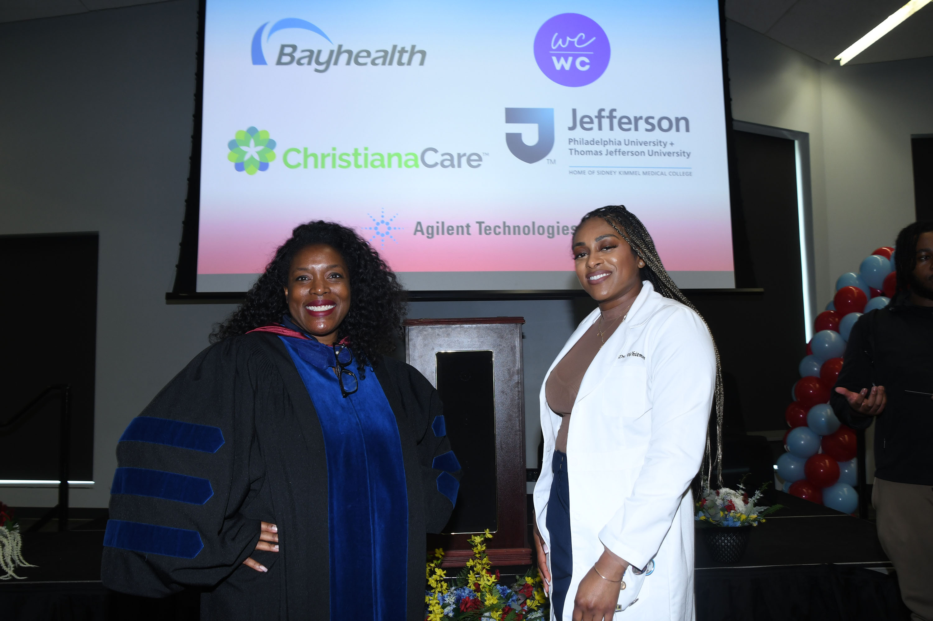 Dr. Cherese Winstead Casson, Dean of CAST, and Dr. Aurellia Whitmore, White Coat White Collar founder, and the list of partners.