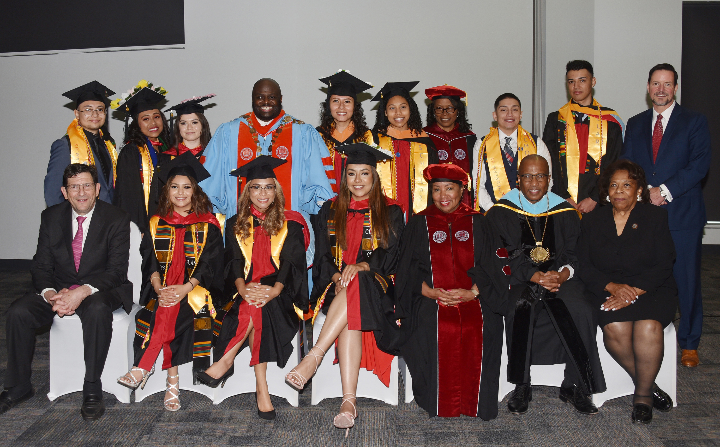 A group of graduating Dreamers pose with the DSU President and others.