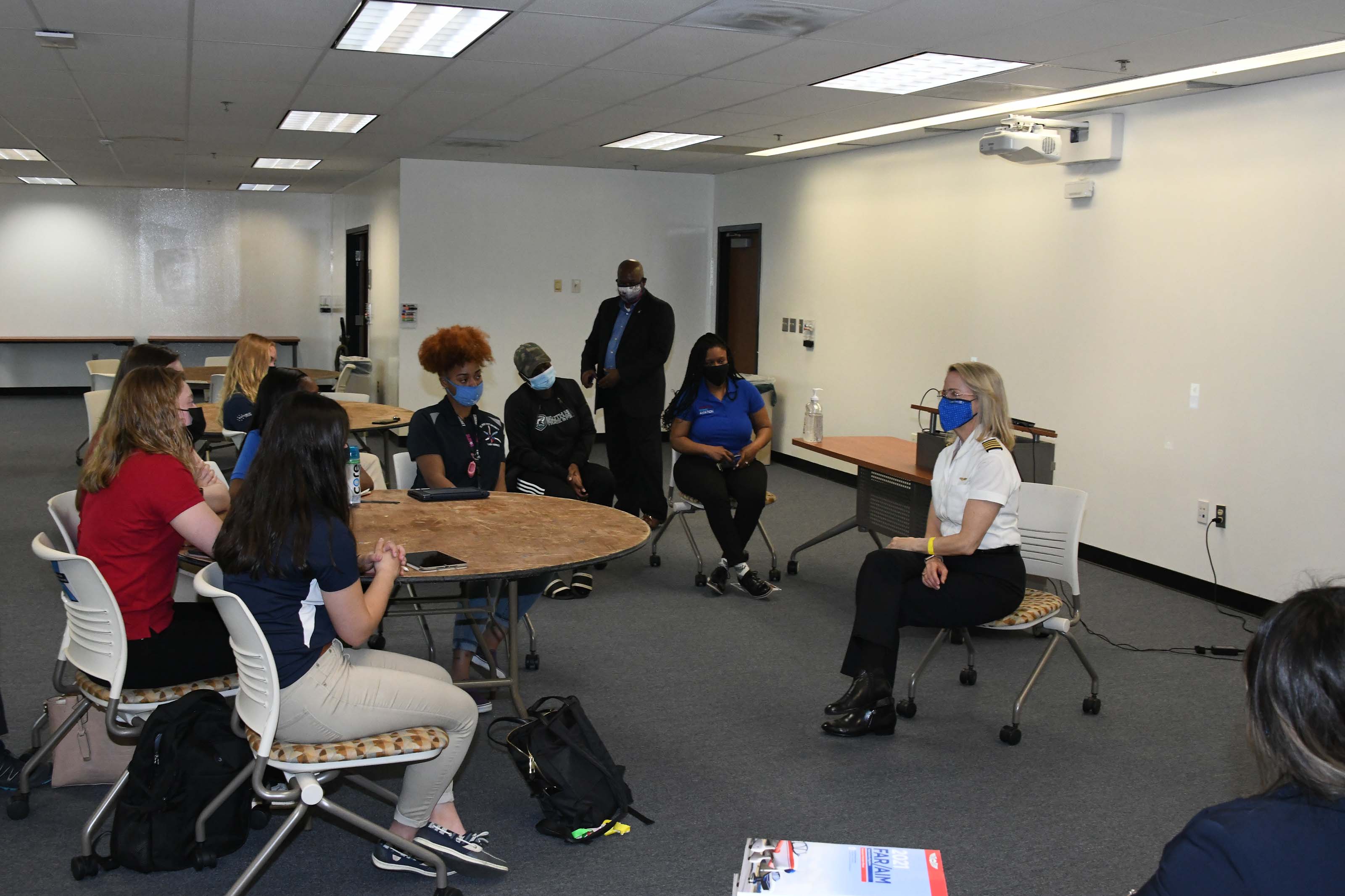 Chief Pilot Mary Ann Schaffer meets with female Aviation students.