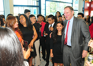 Donald Graham (r) stand with Dreamer Estephany Martinez during a 2017 visit to DSU.