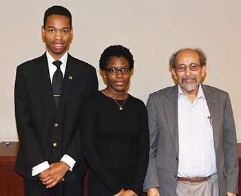 First-place winners Joshua Patterson and Destiny Davis pose with Dr. Mazen Shahin, director of the University's AMP Program