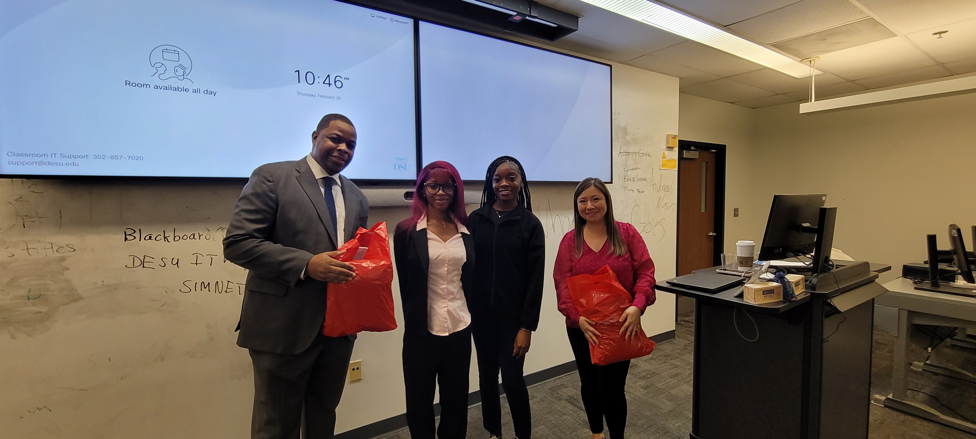 Eric Chandler and Claudia Headrick of FINRA interact with DSU finance students.
