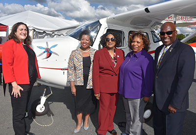 Rep. Debra Heffernan, Dr. Devona Williams, Drt. Wilma Mishoe, Rep. Stephanie Bolden and Lt. Col Michael Hales with new plane.