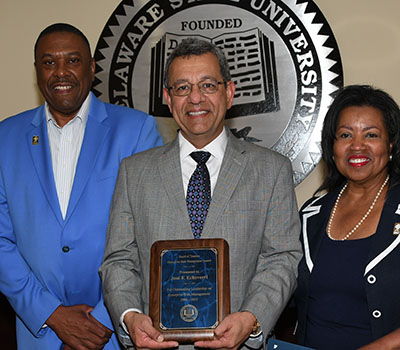 Jose Echeverri (center) received Board's Enterprise Risk Management Award.