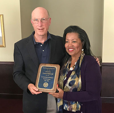 Charles McDowell (l) receives the Board's Governance Award from Bd. Chair Devona Williams. 