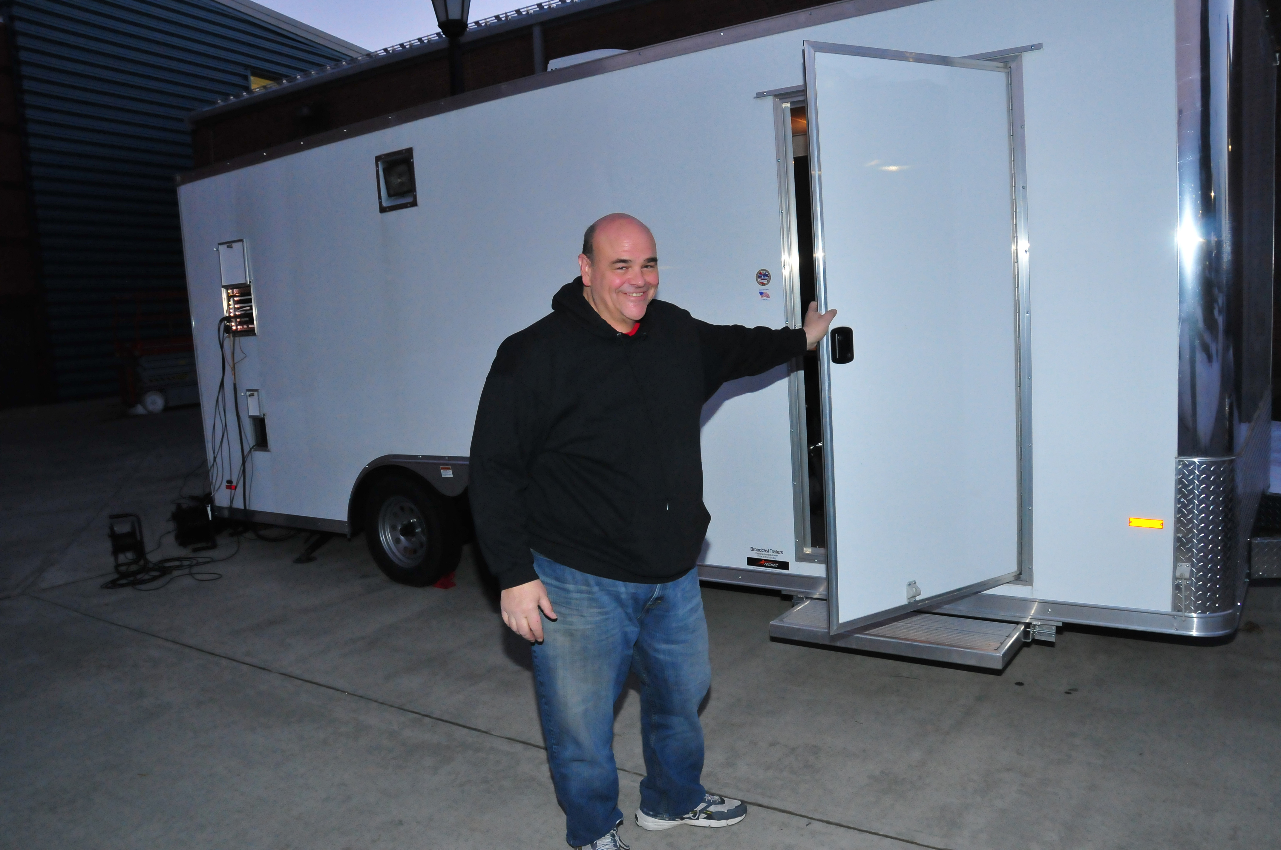 Vince "Chelli" Ciammaichelli, Mass Comm technology director, stands outside of the Mobile Video Production Trailer. 