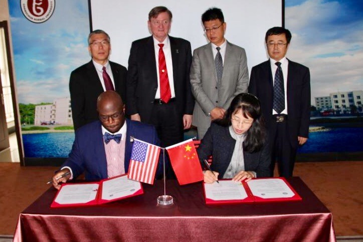 DSU Provost Tony Allen (seated left) sign a MOU agreement with Chanchung Normal University officials. 
