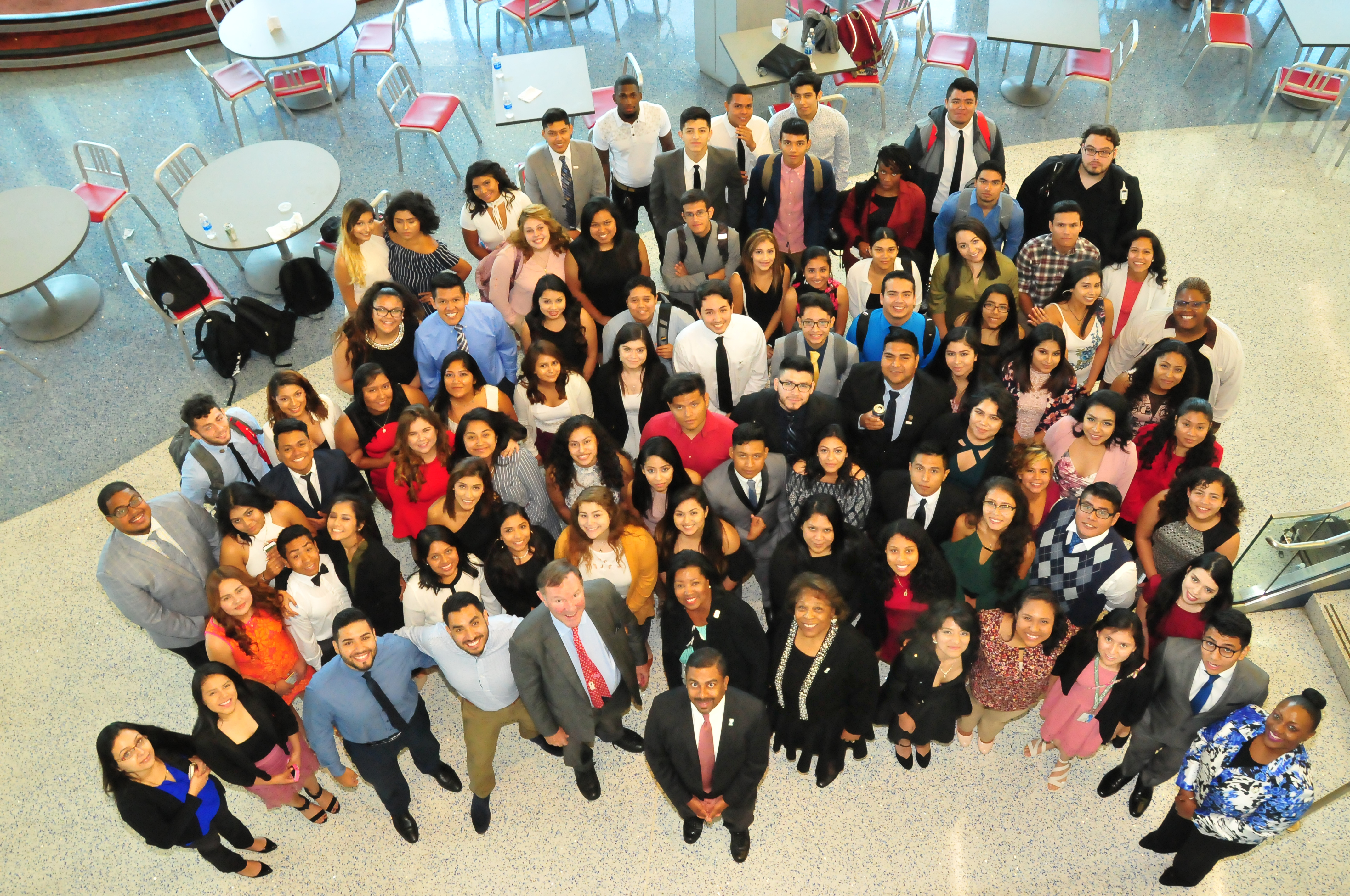 The entire group of 76 DSU Dreamers and DSU officials look up at the camera.