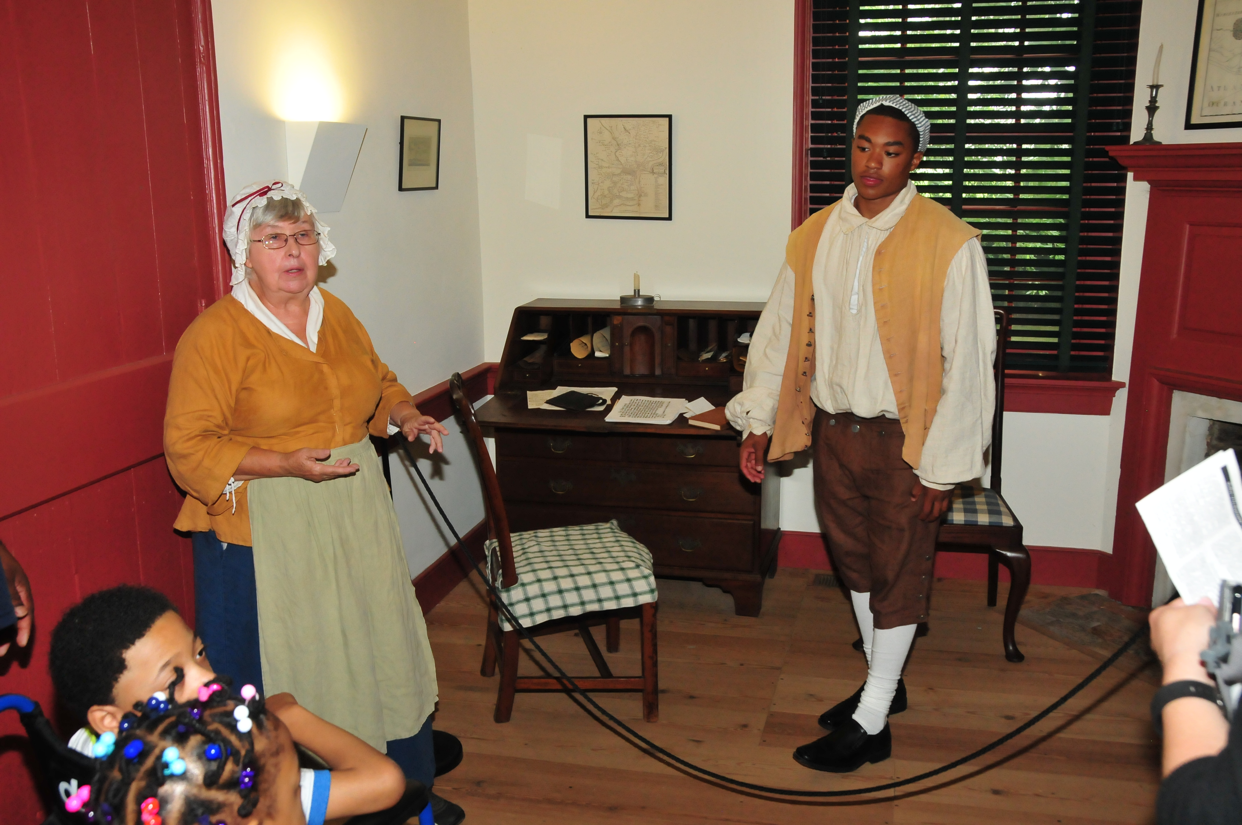 (L-r) Museum presenter Barbara Carrow and DSU student Michael Robinson talk about life at the John Dickinson Plantation