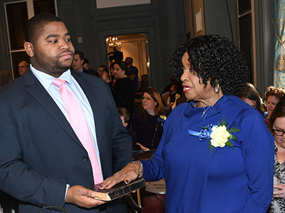 Rep. Stephanie Bolden is sworn in for her fifth term. Holding the bible is her nephew Colby Owens.