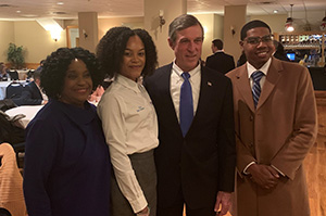 (L-r) Rep. Stephanie Bolden, Nikela Roderique, Gov. John Carney and Tarik Jackson pose at the Black Caucus event.