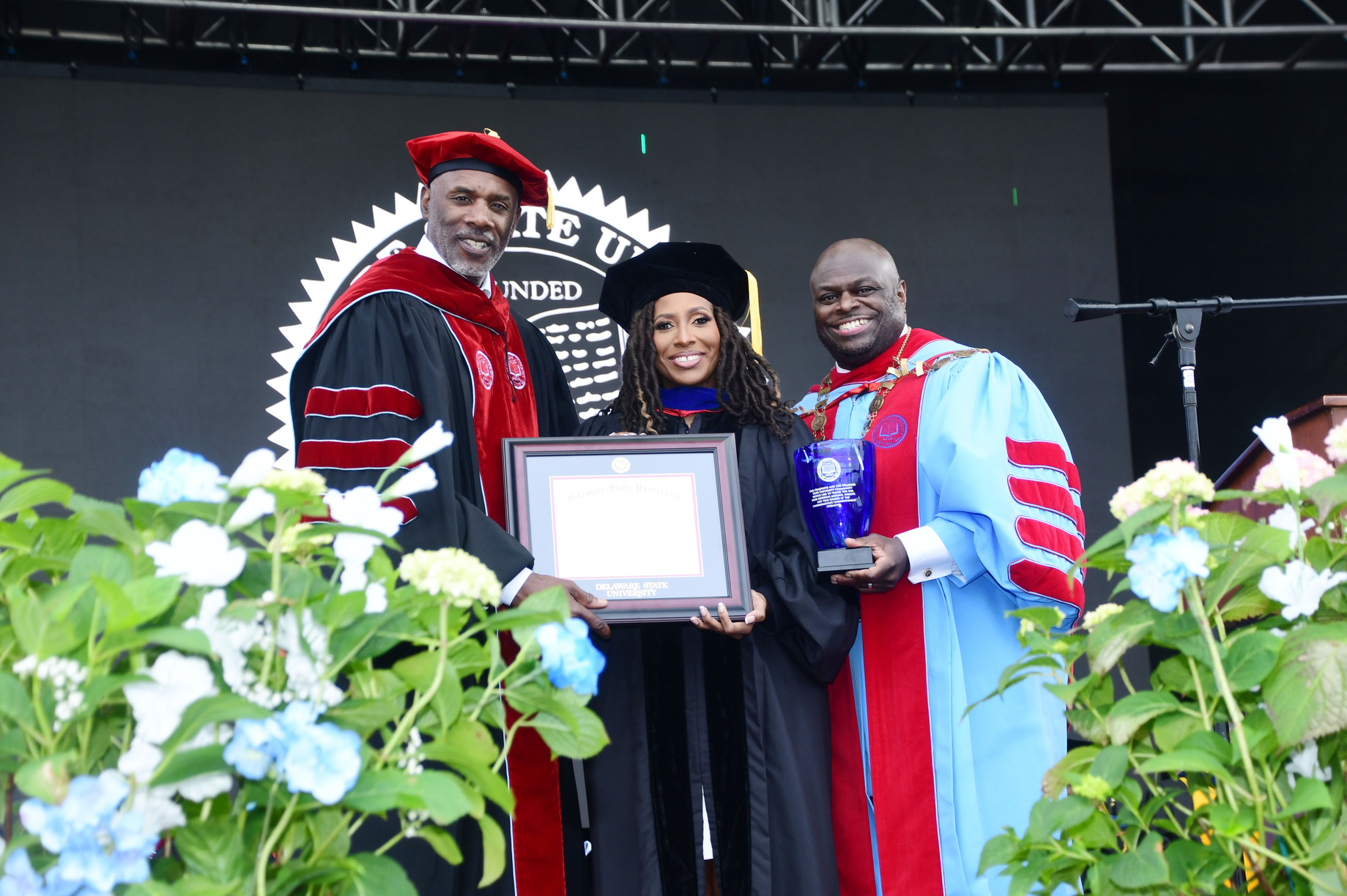 Chairman Leroy Tice and President Tony Allen present Jotaka L. Eaddy with an honorary degree.