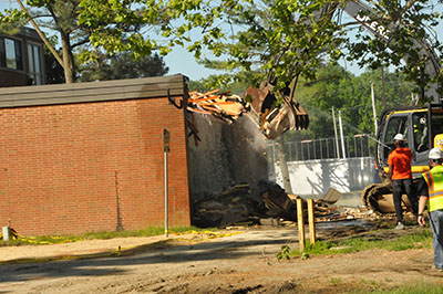 The demolition began on May 24 by tearing down the former TV room of Laws Hall.
