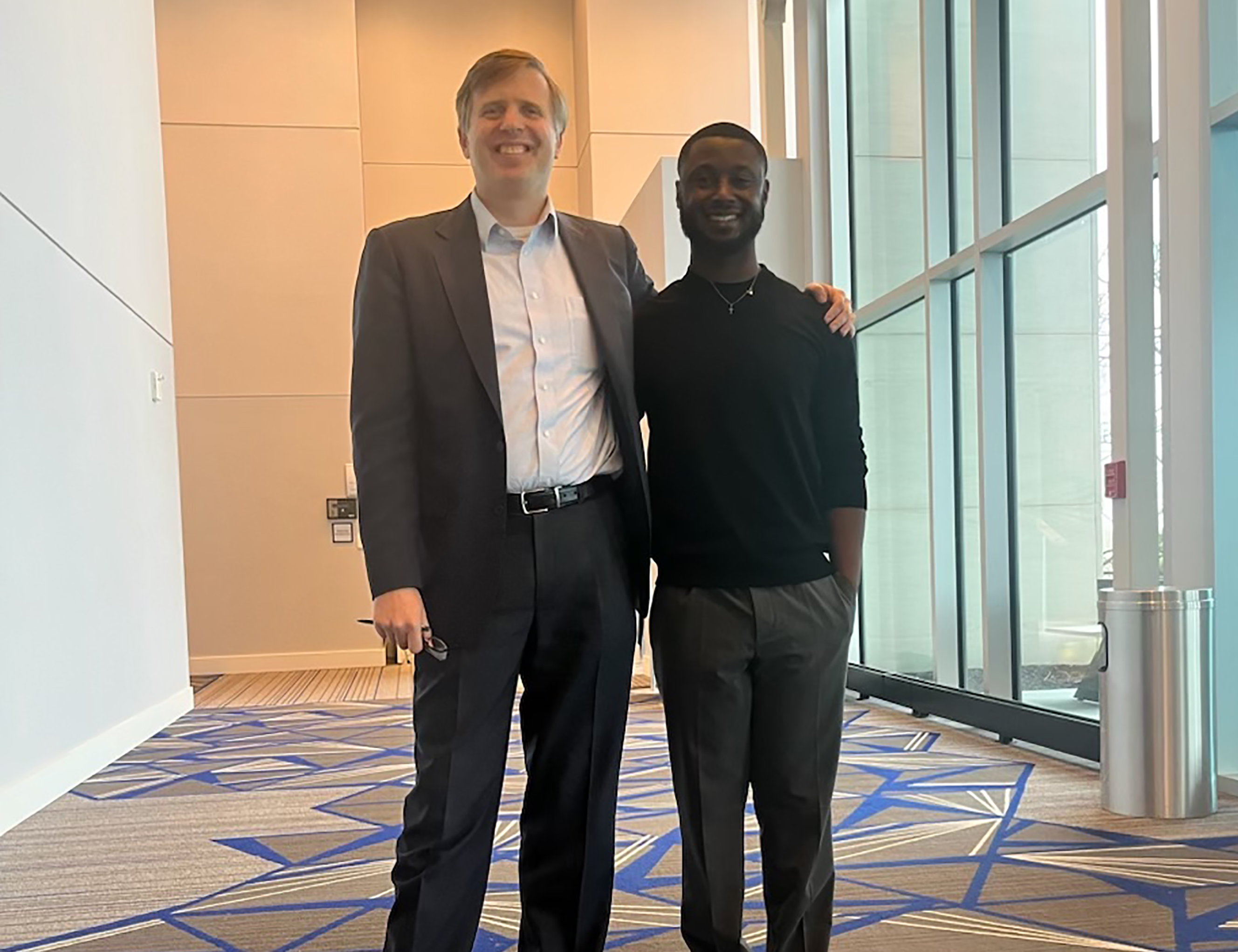 Dr. Rodney Wallace (l) of the Foundation for Innovation in Healthy Food stands with Mekhai Abrams at the Kansas city conference.