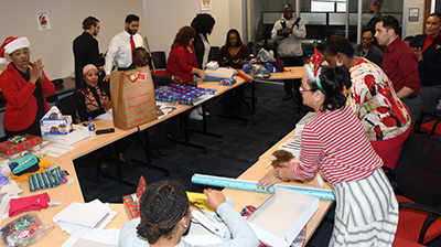 The gift wrapping work was an all-hands-on-deck affair.