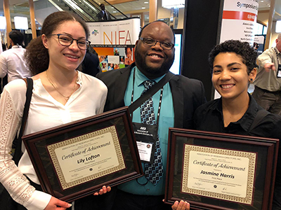 Lily Lofton (l) -- 3rd place Oral Presentation; Jasmine Harris (r) -- 1st place Poster Presentation; with Dr. Kwame Matthews. 