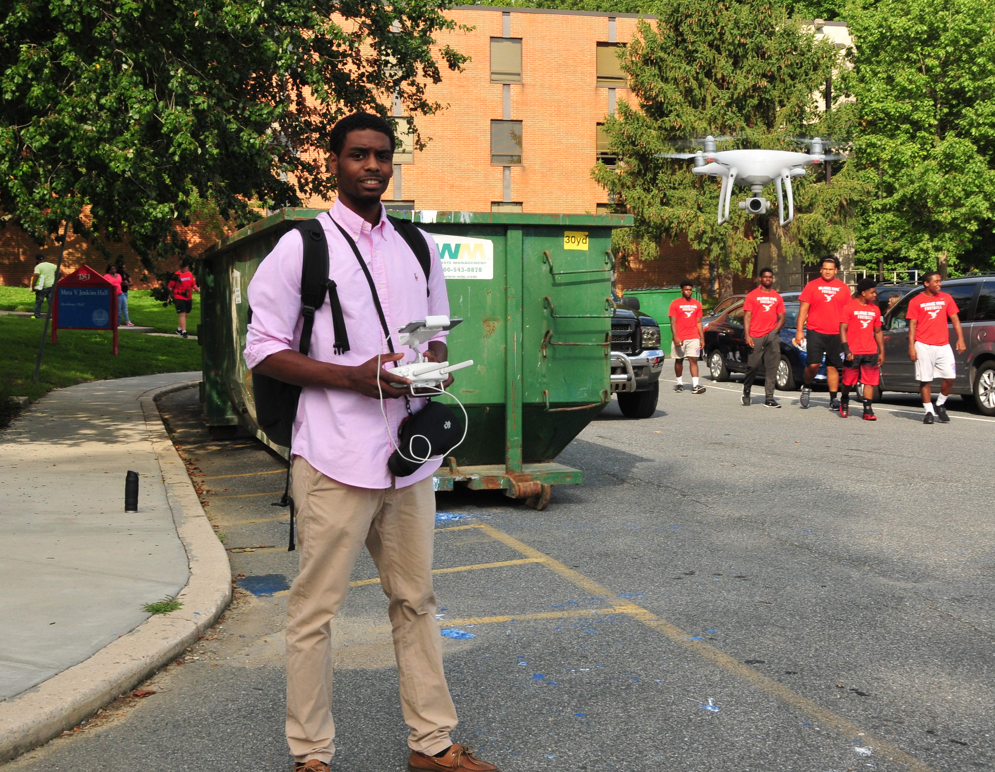Rashaun Bosley flies his drone to get footage of the residential hall move-in activity in August.