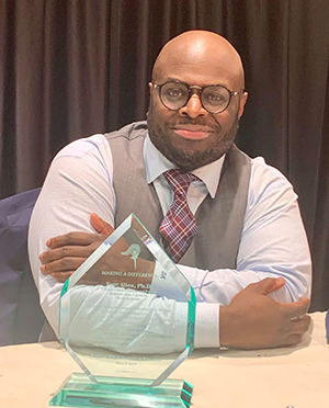Provost Tony Allen possess with his "Make a Difference Award" he received after he gave a keynote address at the HBCU Summit.