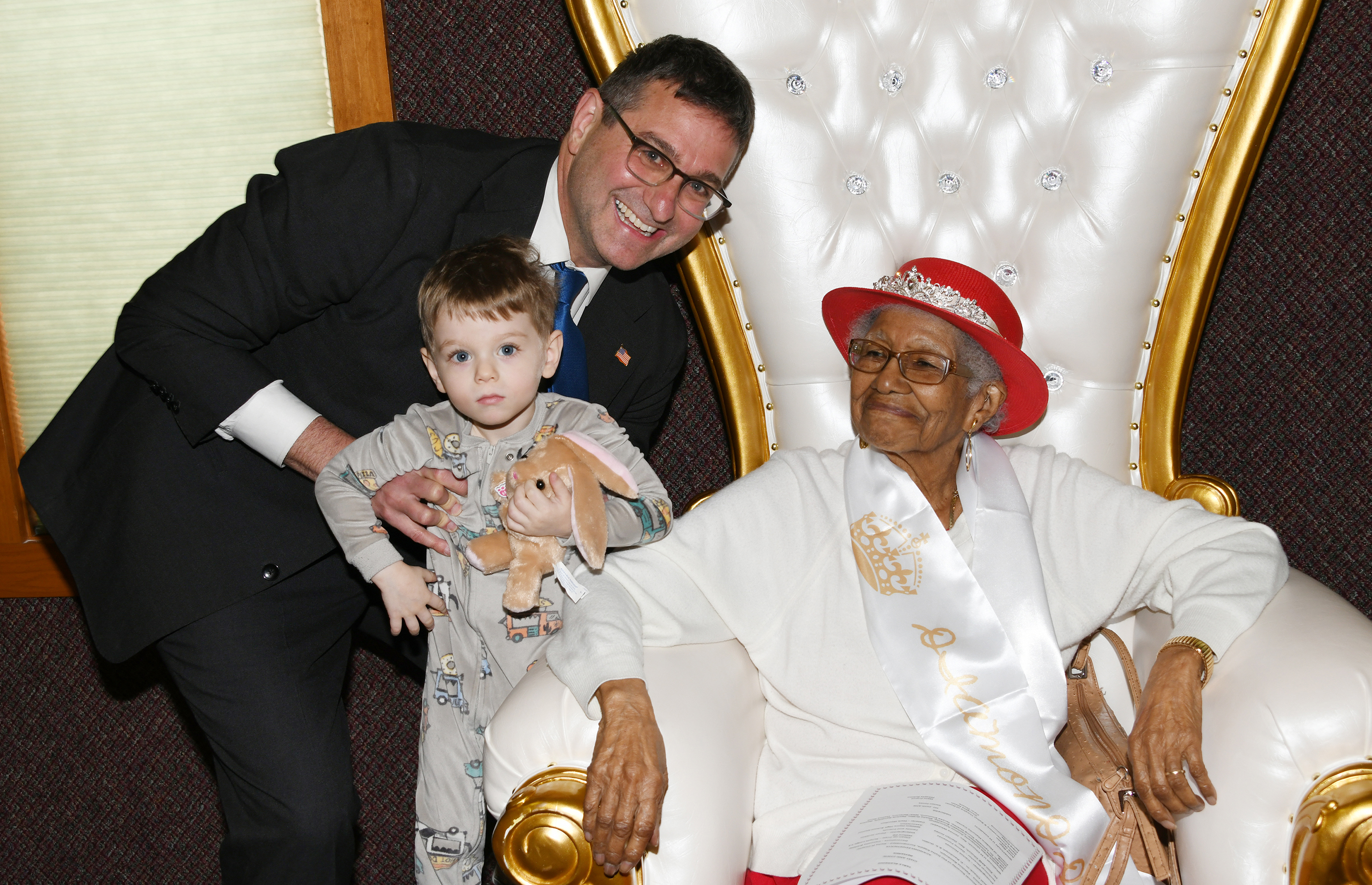 Delaware Gov. Matt Meyer and his son Levi pose for a photo with Susan Young Browne.