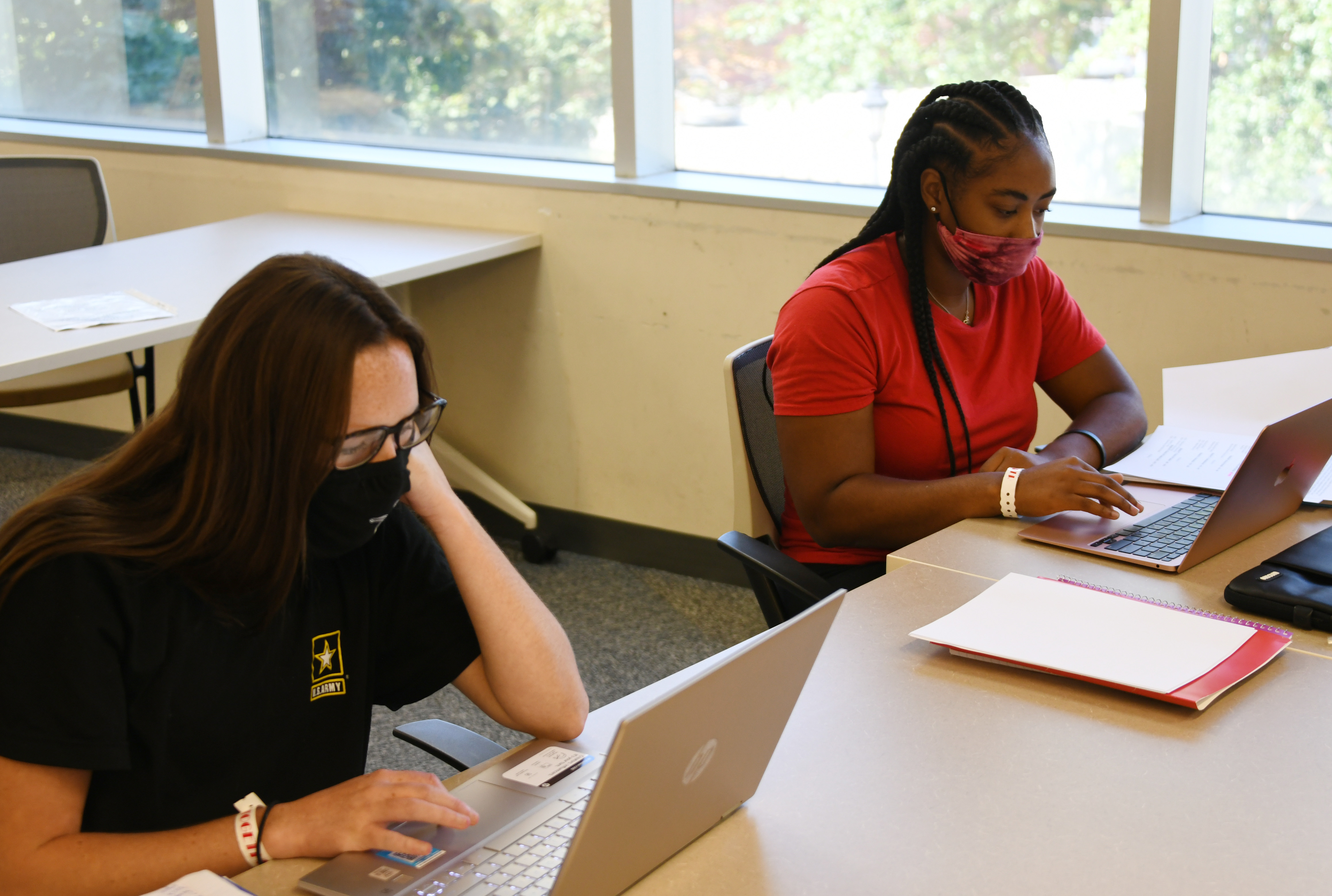 (L-r) Freshmen Madison Burnite and Mayanah McIntosh are not procastinating with their studies. 