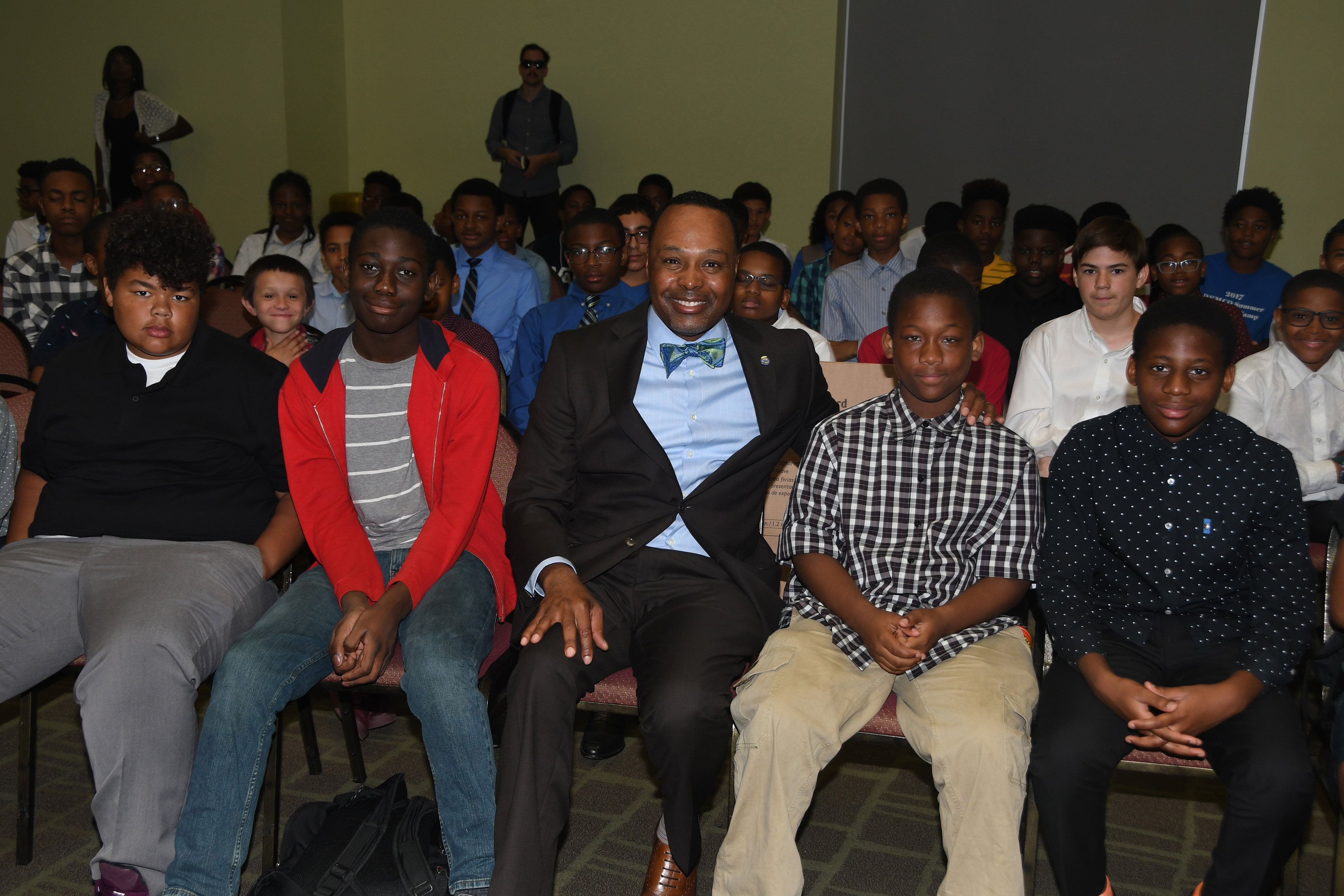 James Collins (center), chief information officer for the State of Delaware and the keynote for the Verizon DSU Innovative Learning Presentation Day Program, poses with the middle school youths that participated in the three-week summer camp.
