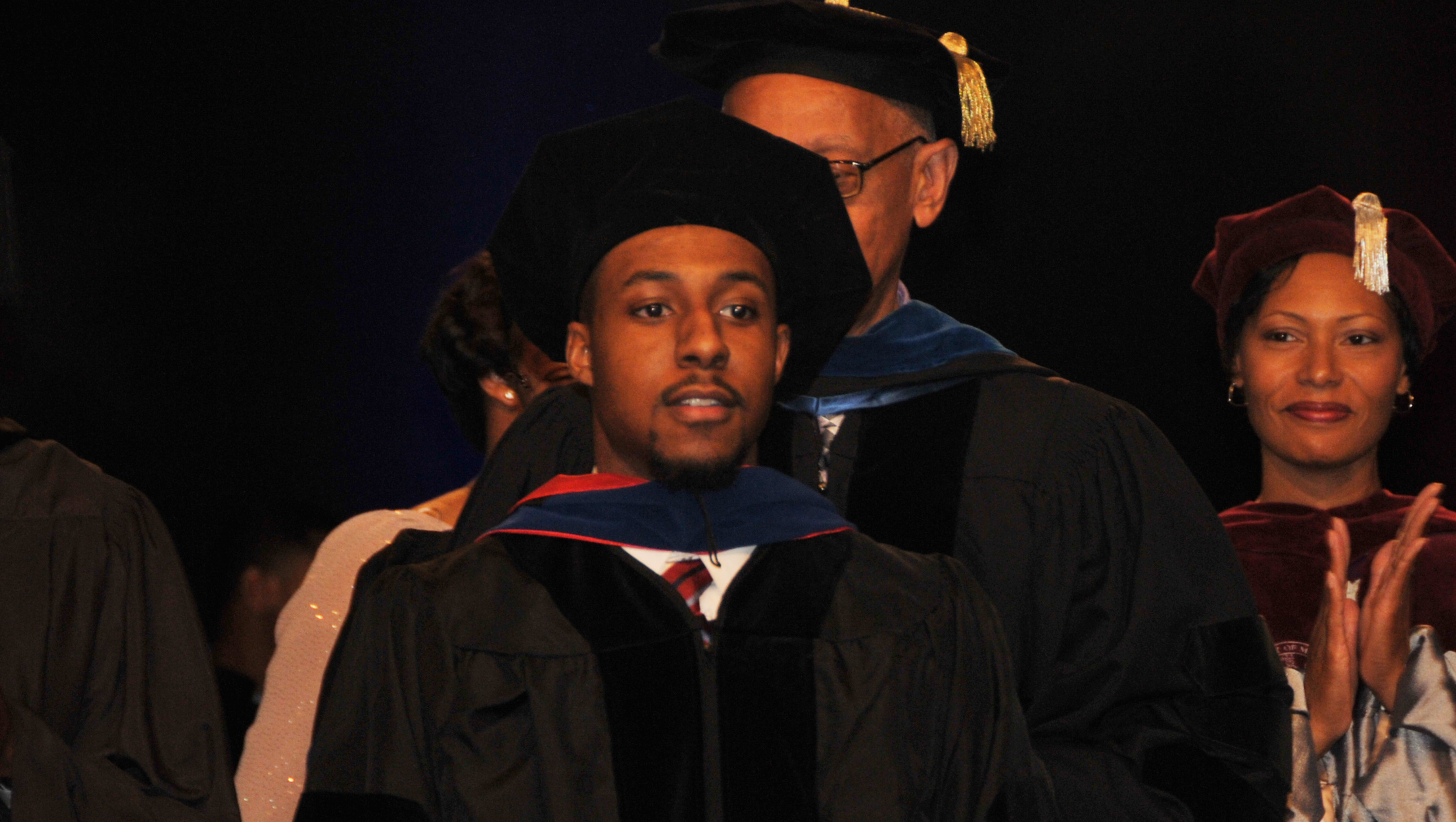 Dr. Jalaal Hayes -- shown in December 2015 when he became the youngest ever Ph.D. graduate in DSU history -- is now being honored as the Top Influential Chemist of the Year by the International Association of Top Professionals.