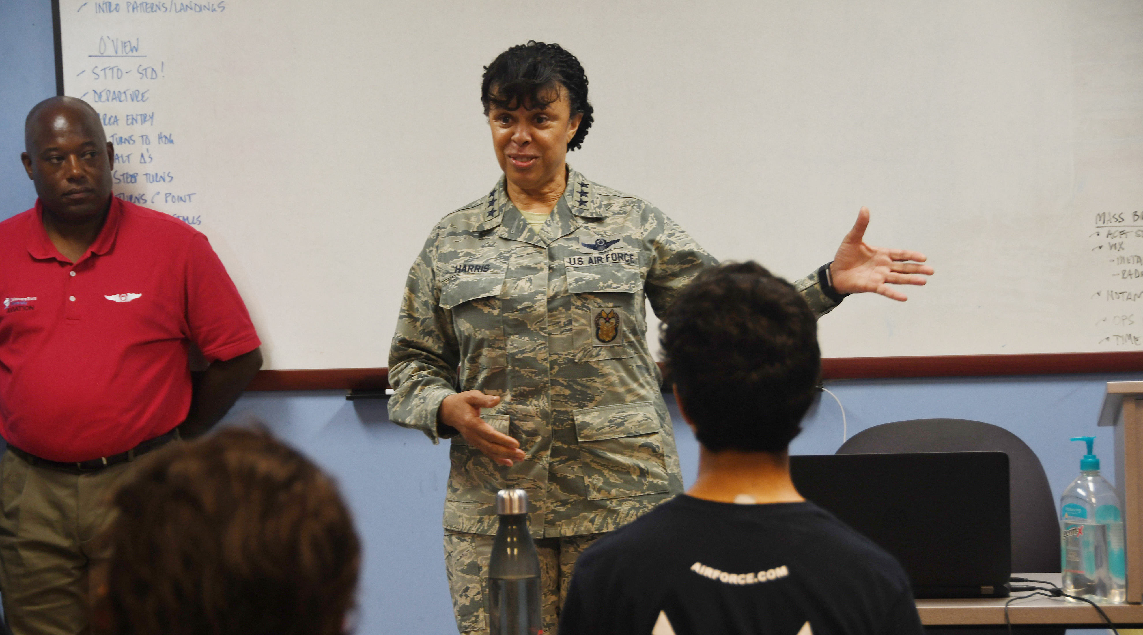 Lt. Gen. Stayce Harris, the highest ranking African-American femaie pilot in the U.S. Air Force, speaks to a group of ACE Program trainees at the Delaware Airpark, site of the DSU Aviation Program. 