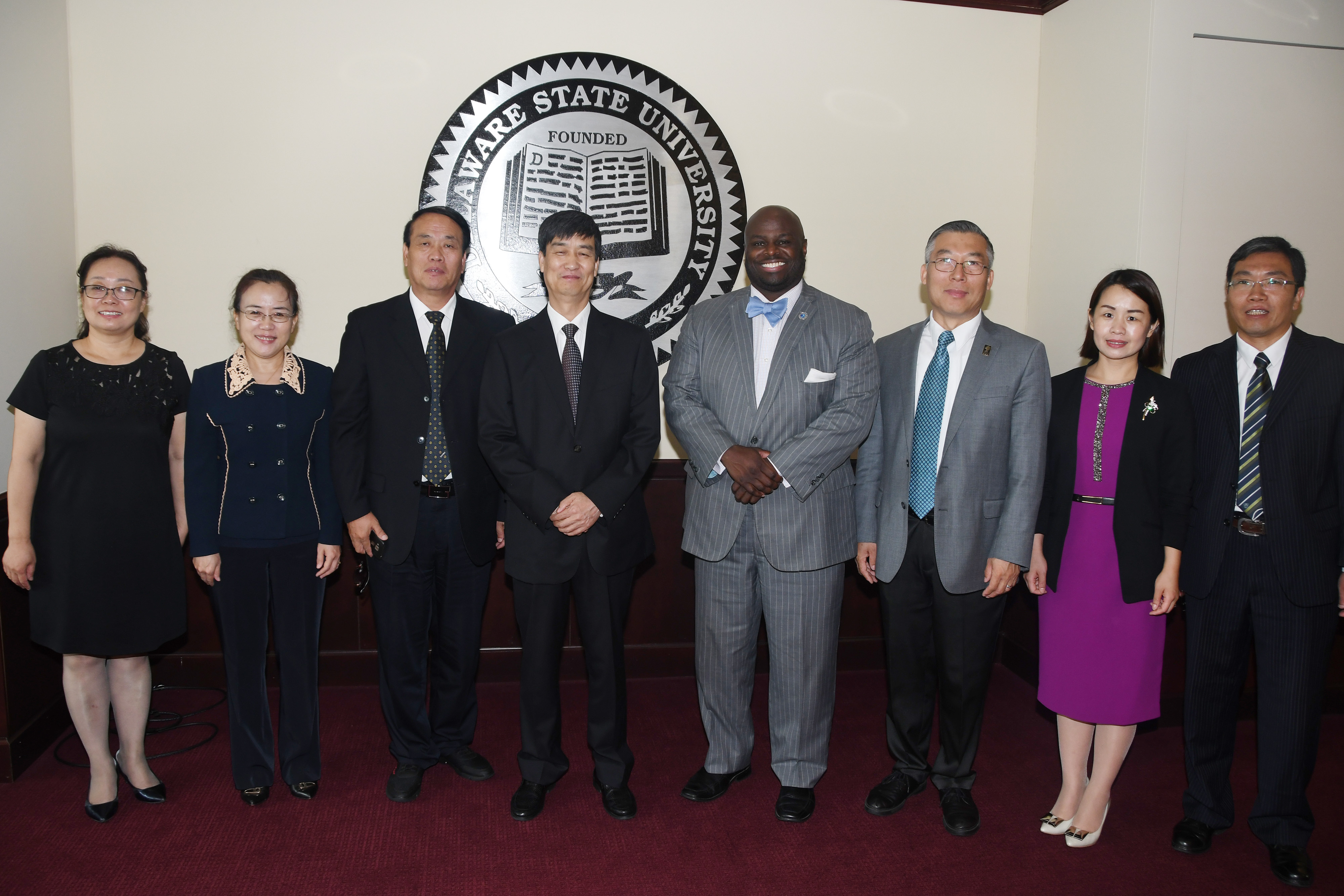 (L-r) Dr. Tian Yi, DU director of DU College of Music; Dr. Zhang Guoqiang, director of DU College of Foreign Languages; Dr. Xu Jing, director of Academic Affairs; Dr. Liu Wenlie, DU chairman; DSU Provost Tony Allen; Dr. Fenghan Liu, DSU associate vice president of International Affairs; Dr. Du Yali, DU director of International Exchange and Cooperation; and Jiao Dejie, DU director of the College of Life Science.