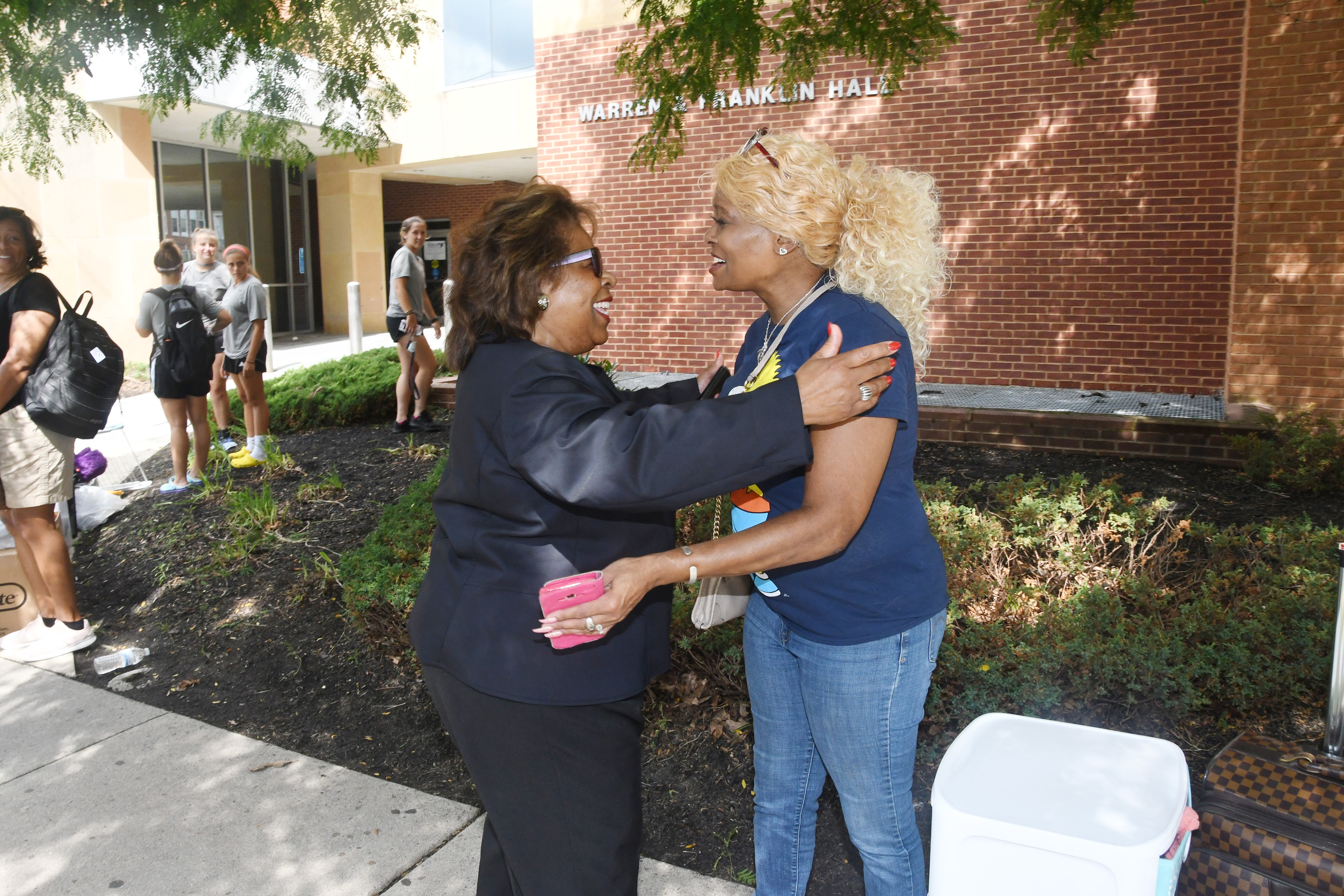 DSU President Wilma Mishoe greets a parent during Move-In Day on Aug. 22 in front of Warren Franklin Residential Hall.