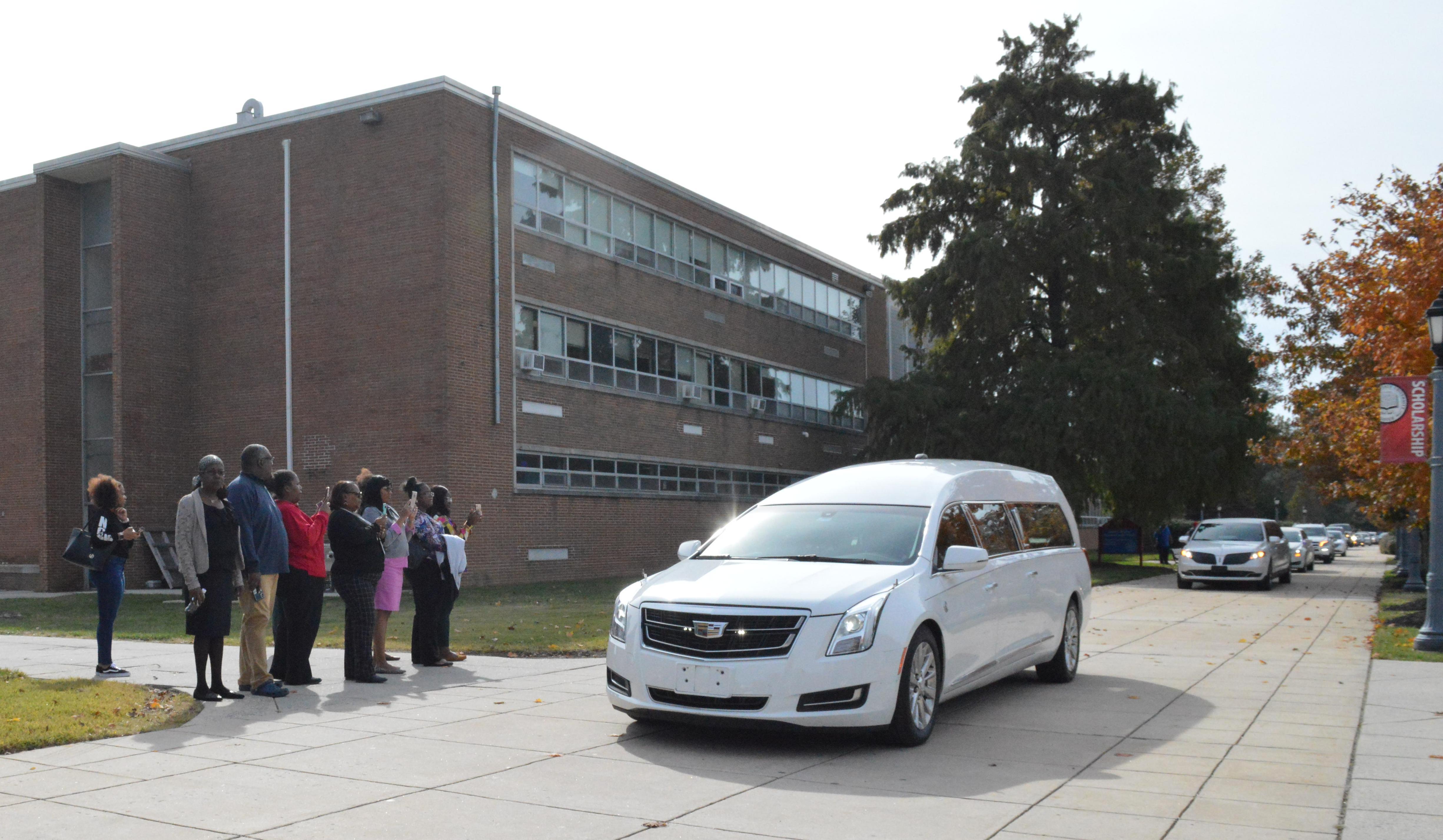 The hearse carrying the body of Dr. Ulysses S. Washington take the former longtime head of the Department of Agriculture and Natural Resource a final trip through the campus after the Celebration of Life service held in the Education and Humanities Theatre. Photo by Bernard Carr.
