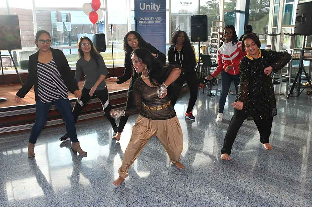 An dancer from Bangladesh teaches some audience participant a dance from her country during the Unity in Diversity event.