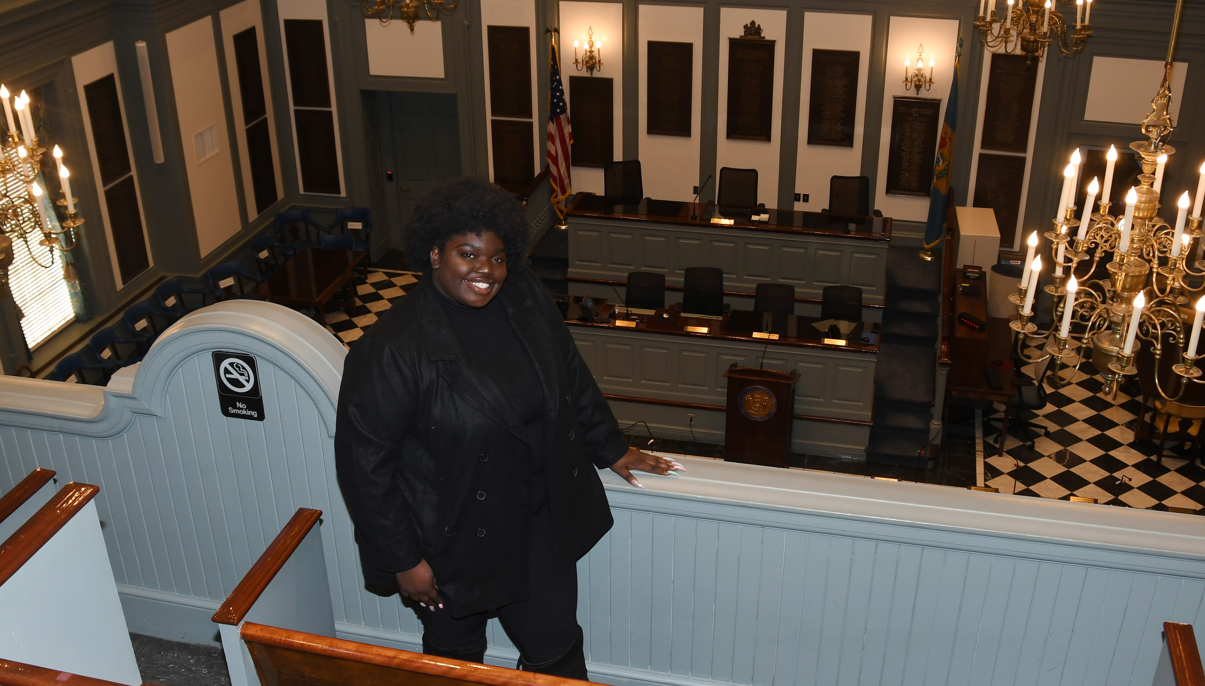 Adriante Carter stands above the Delaware House of Representatives chamber in Legislative Hall in Dover, where she represents the University as a Legislative Fellow. 